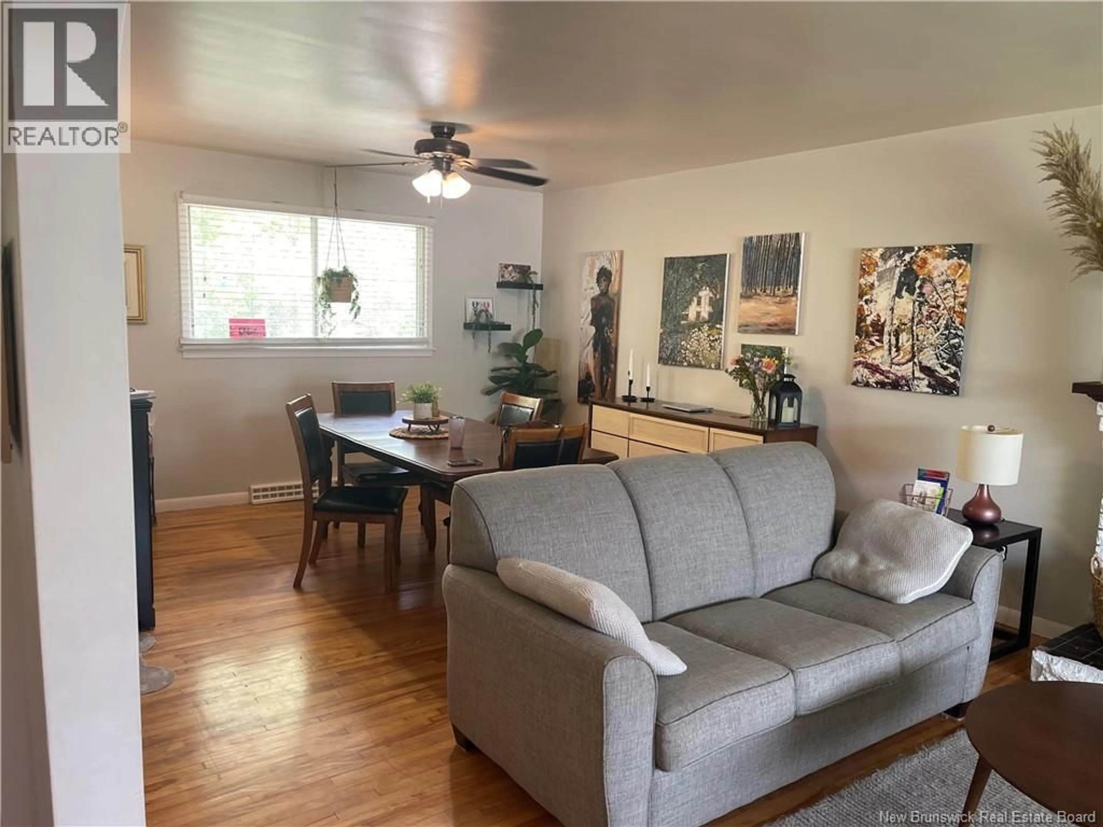 Living room with furniture, wood/laminate floor for 215 EDGETT AVENUE, Moncton New Brunswick E1C7B6