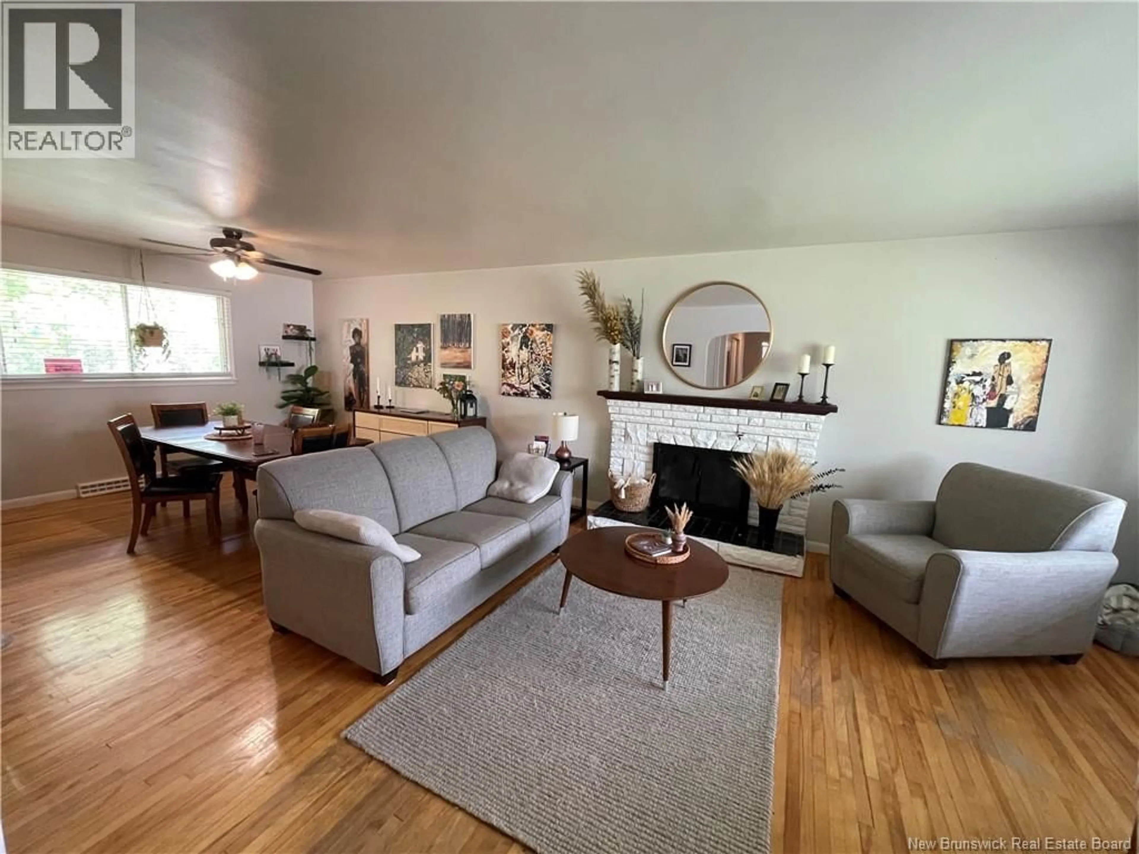 Living room with furniture, wood/laminate floor for 215 EDGETT AVENUE, Moncton New Brunswick E1C7B6