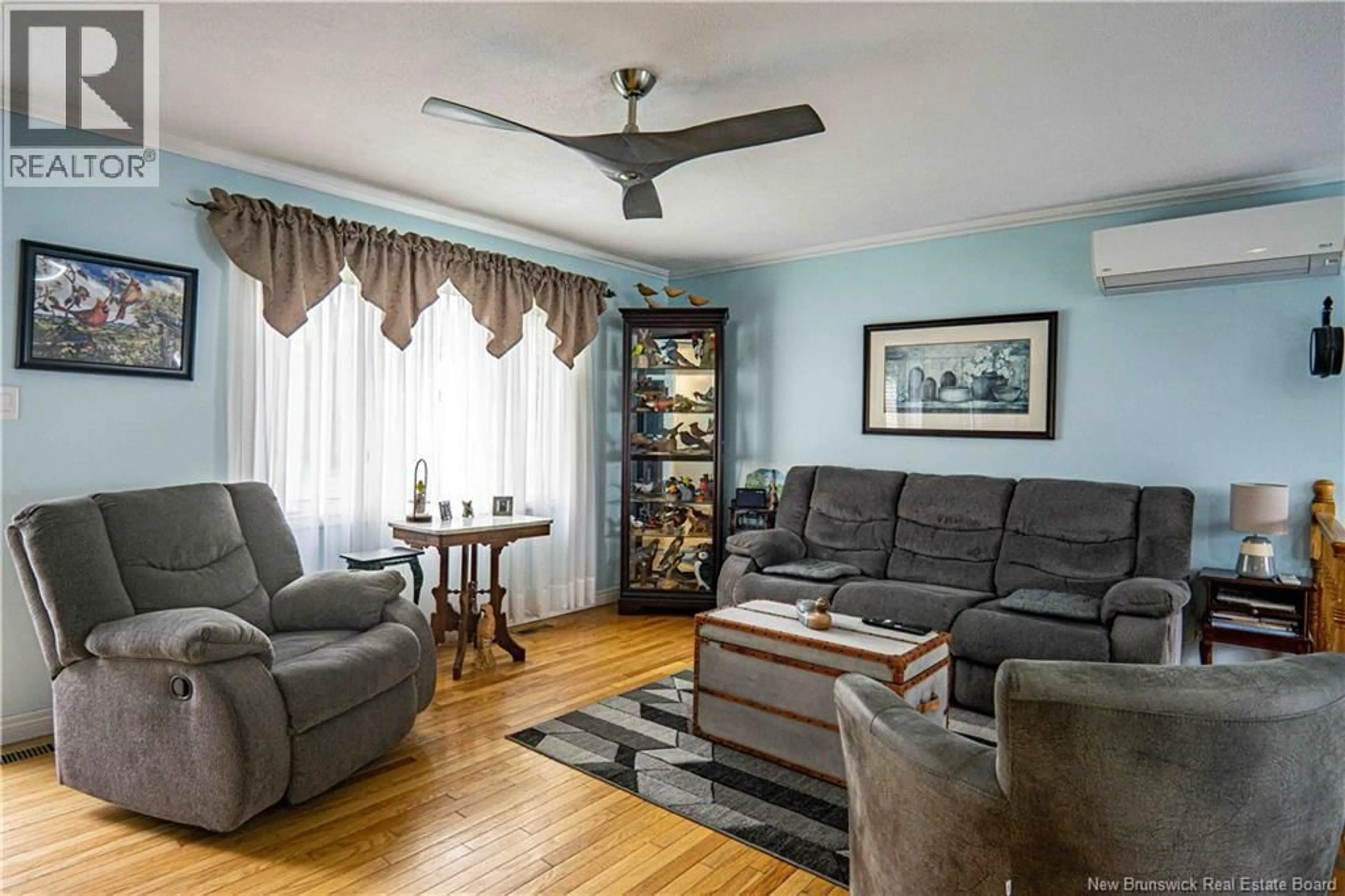 Living room with furniture, wood/laminate floor for 10 DAULPHIN DRIVE, Fredericton New Brunswick E3A4P5
