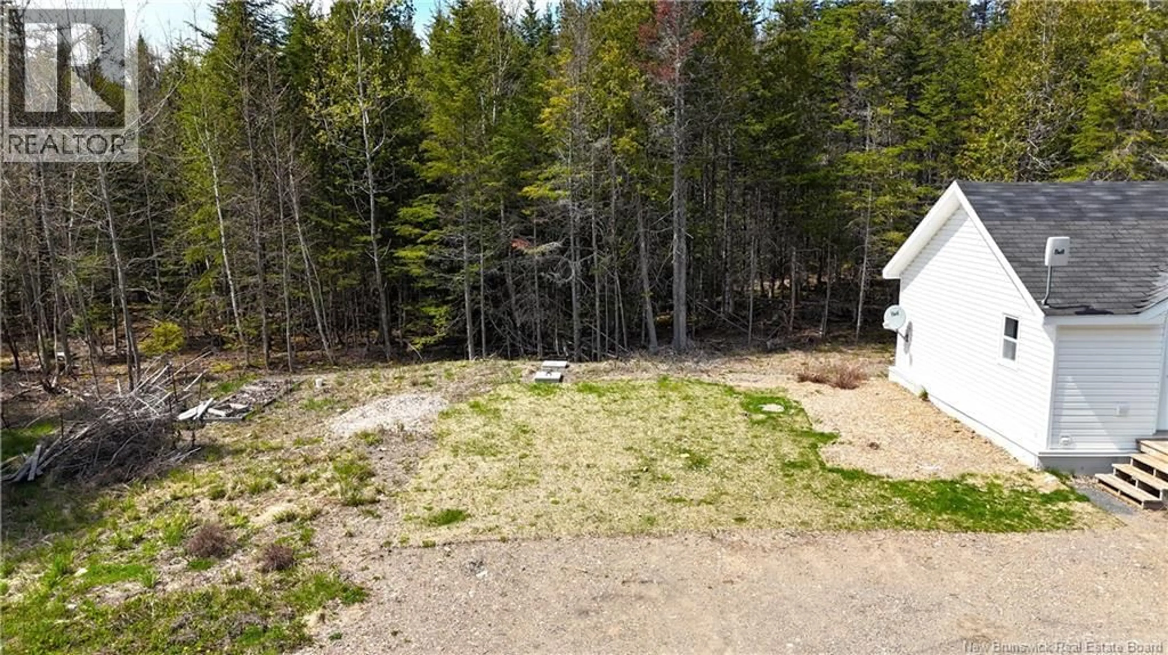A pic from outside/outdoor area/front of a property/back of a property/a pic from drone, forest/trees view for 39 L HARKNESS ROAD, Chamcook New Brunswick E5B3E7