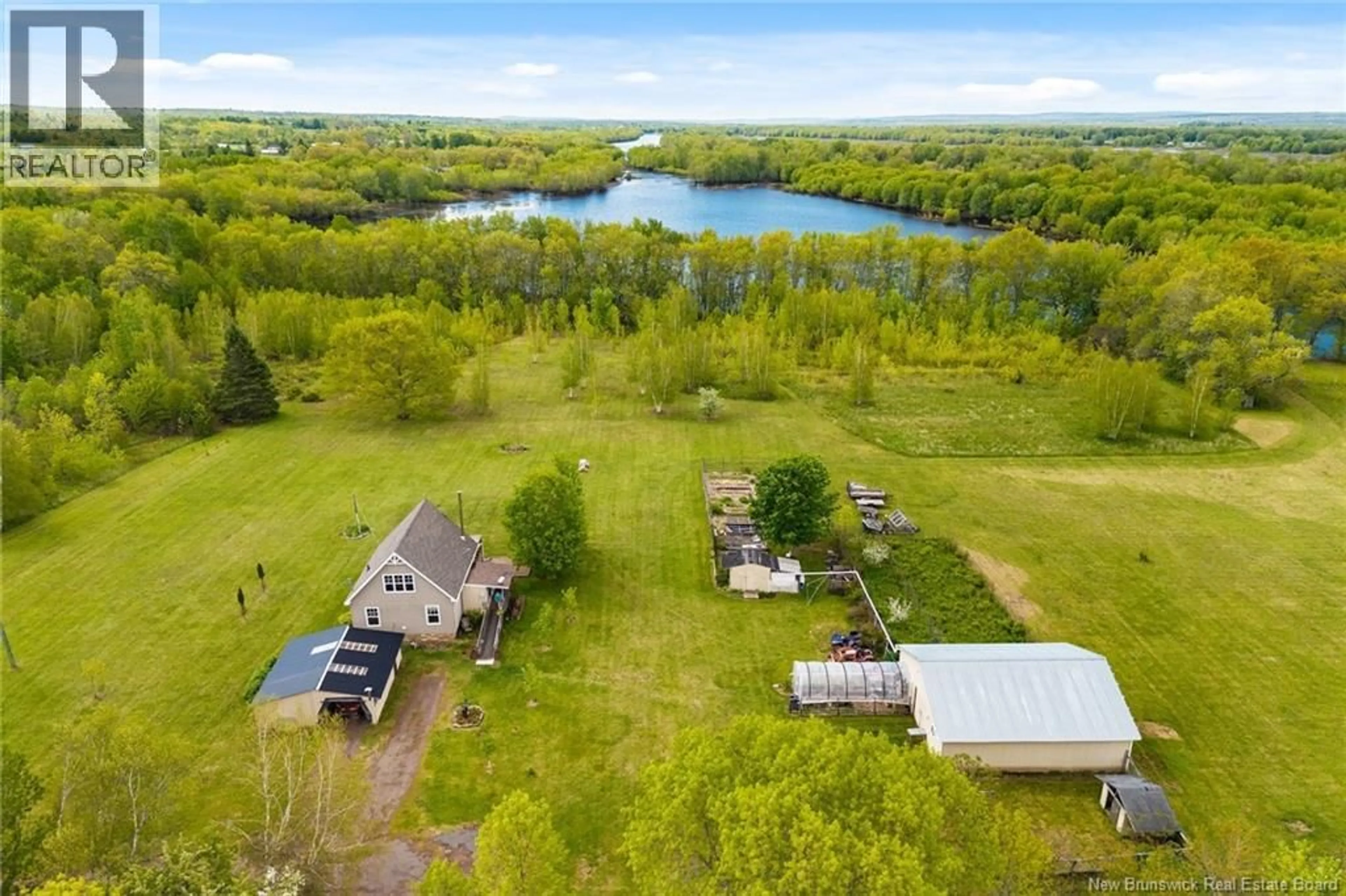 A pic from outside/outdoor area/front of a property/back of a property/a pic from drone, water/lake/river/ocean view for 24 ROUTE 715, Jemseg New Brunswick E4C3M8