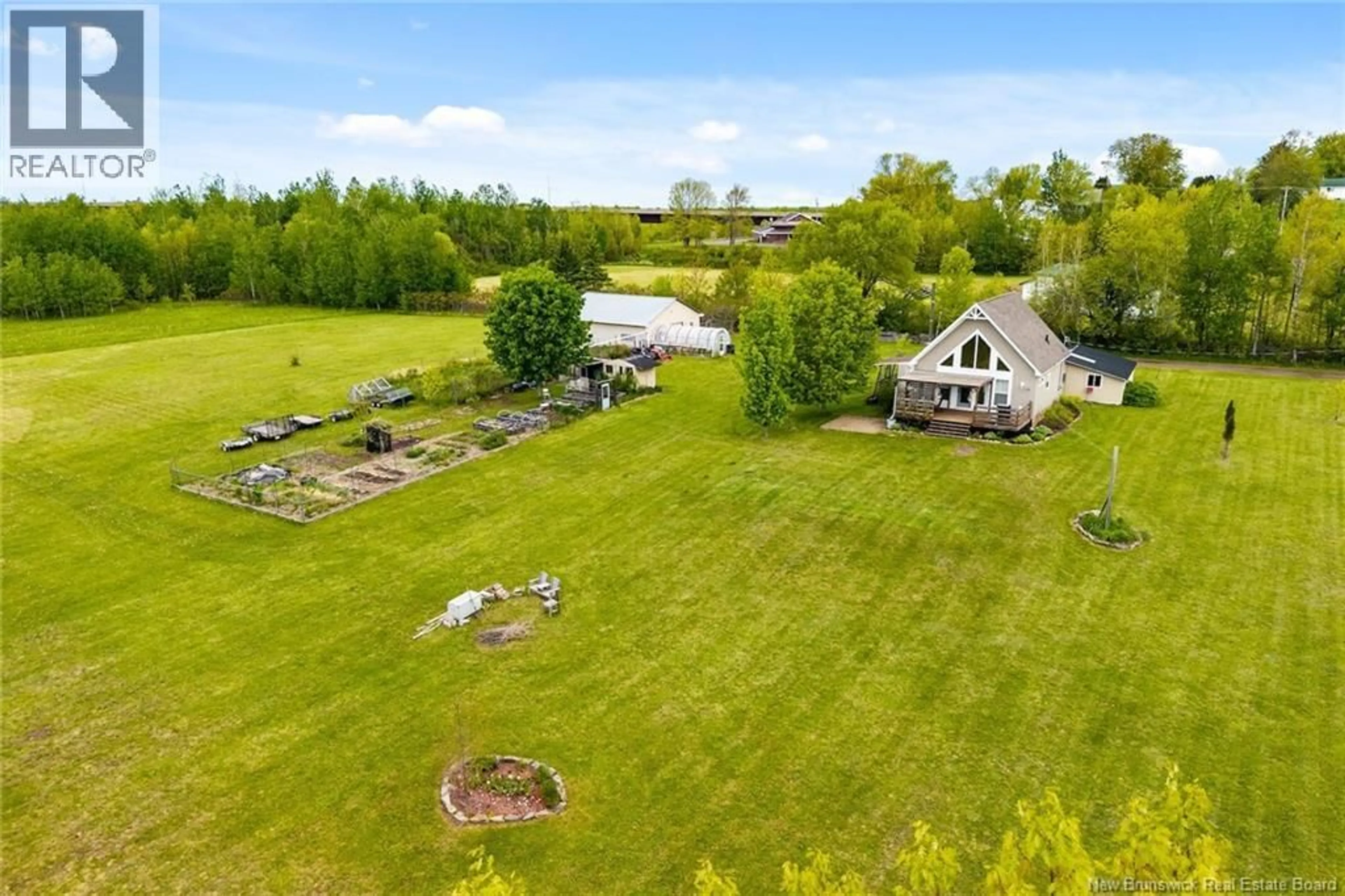 A pic from outside/outdoor area/front of a property/back of a property/a pic from drone, water/lake/river/ocean view for 24 ROUTE 715, Jemseg New Brunswick E4C3M8