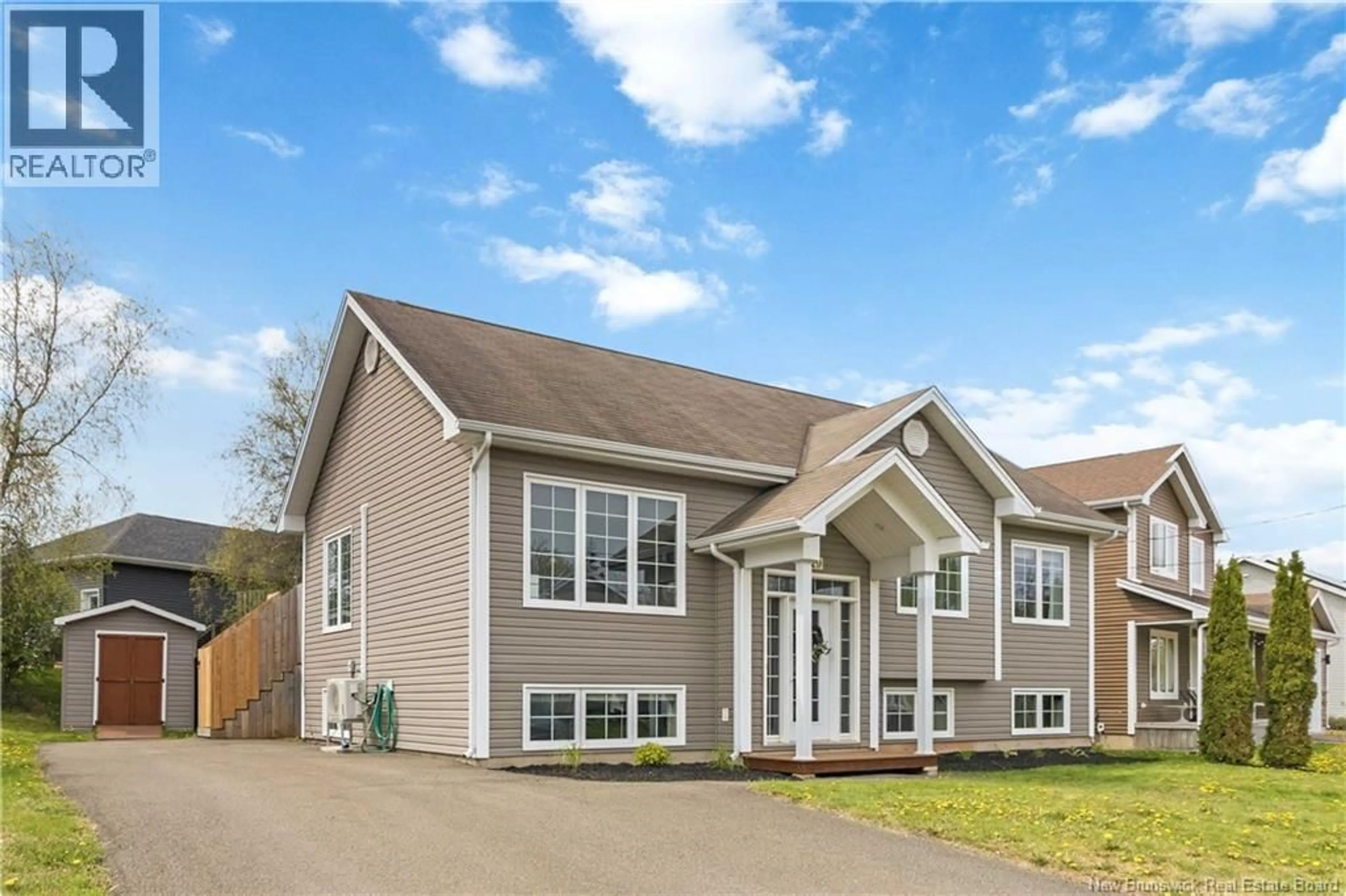 Home with vinyl exterior material, street for 229 DU MOULIN, Dieppe New Brunswick E1A0Y3