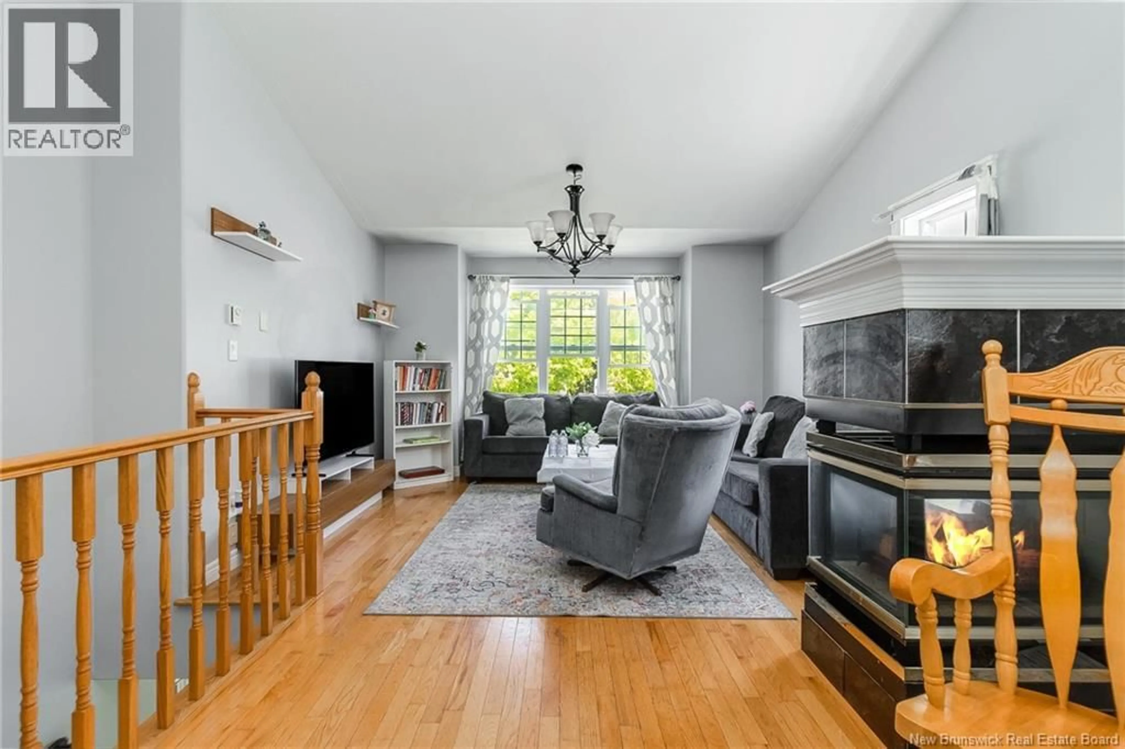 Living room with furniture, wood/laminate floor for 23 DORA DRIVE, Fredericton New Brunswick E3B9L3