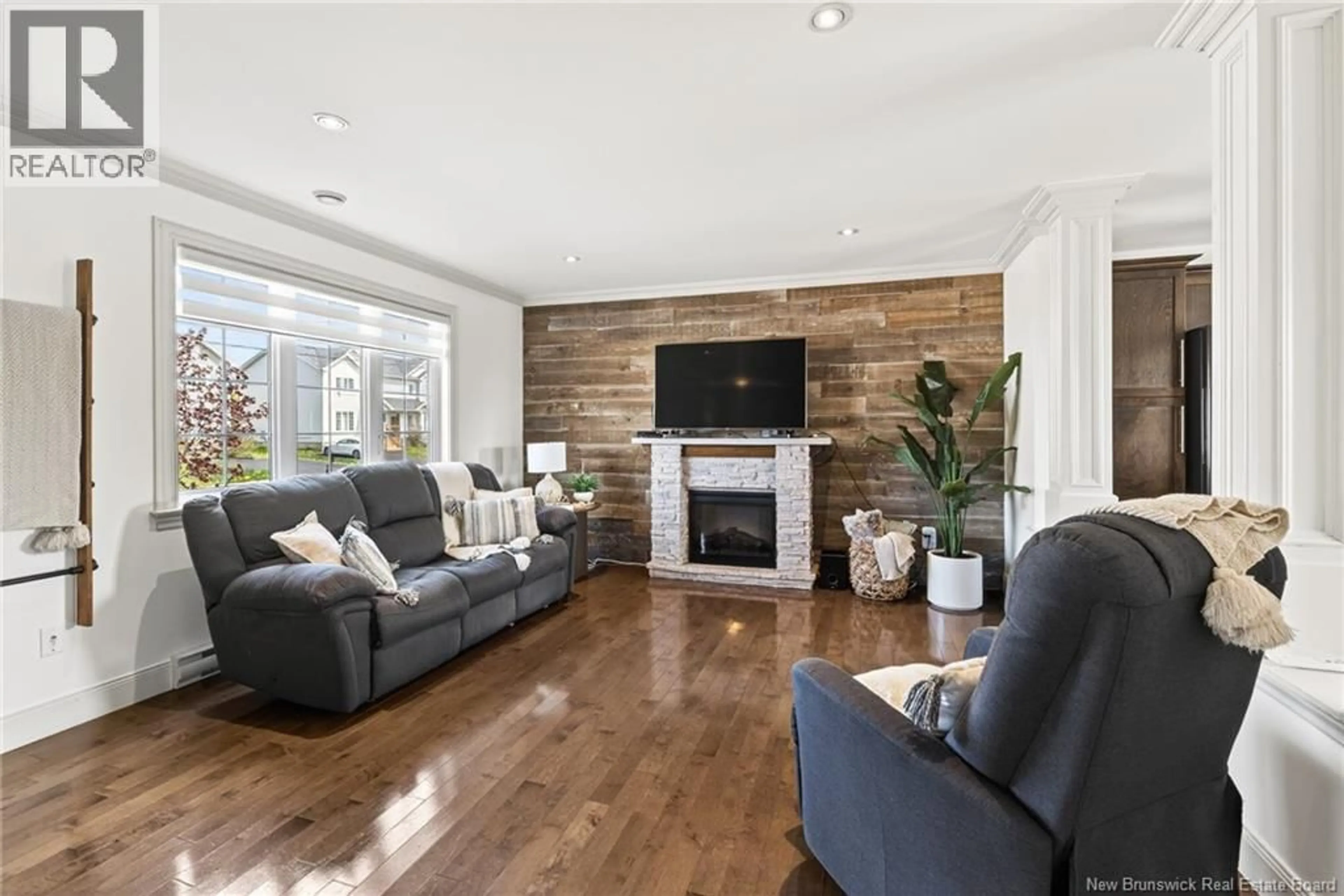 Living room with furniture, wood/laminate floor for 15 LANCEFIELD CRESCENT, Moncton New Brunswick E1E0E7