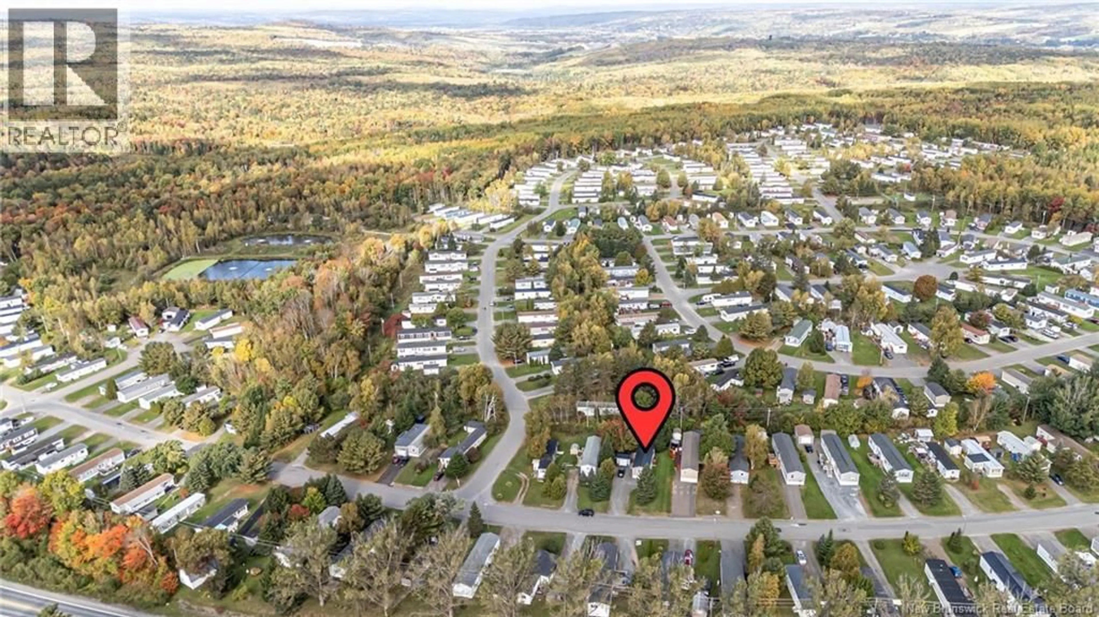A pic from outside/outdoor area/front of a property/back of a property/a pic from drone, street for 86 HEDGEVIEW DRIVE, Fredericton New Brunswick E3B6R7