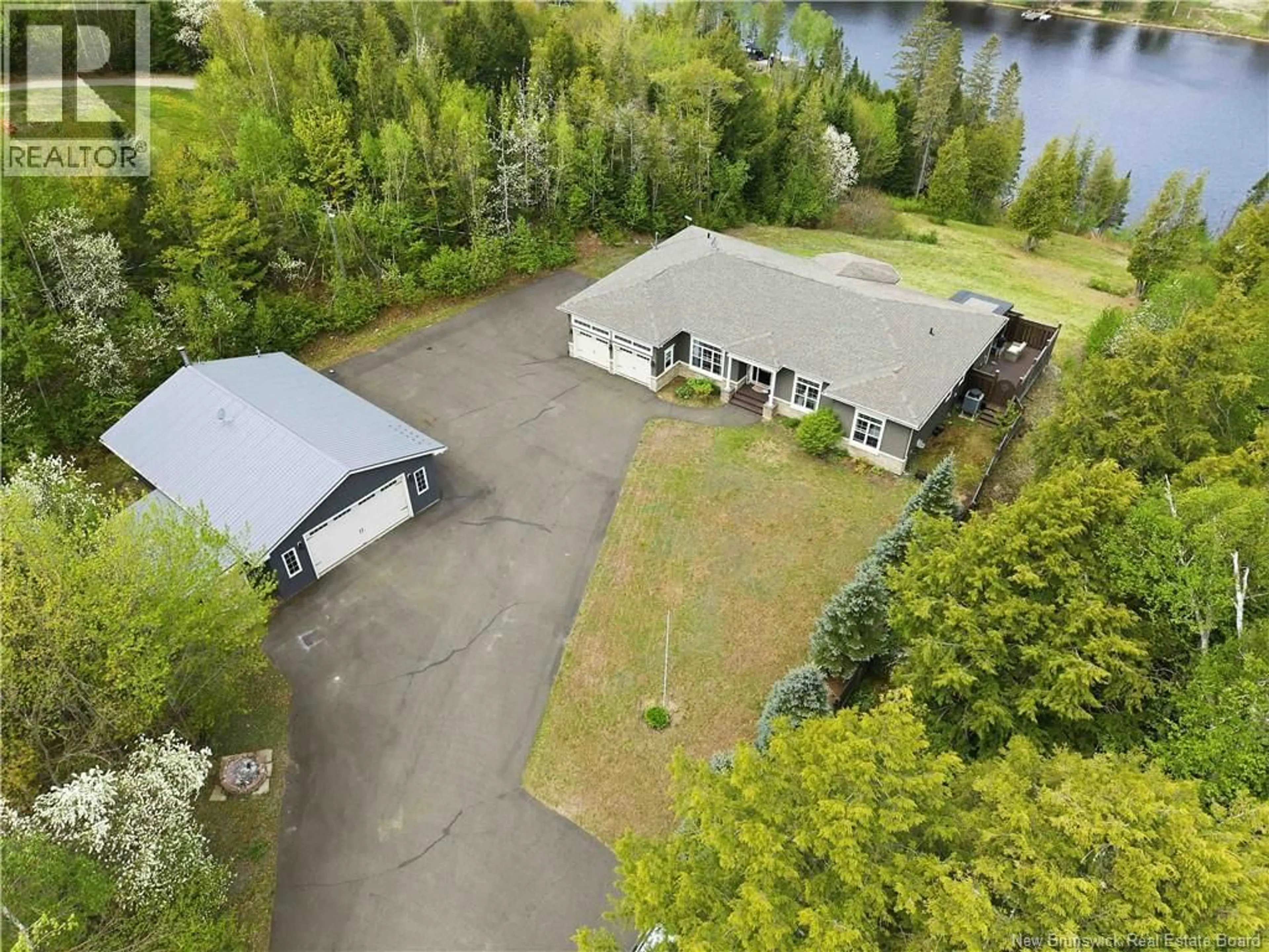 A pic from outside/outdoor area/front of a property/back of a property/a pic from drone, water/lake/river/ocean view for 75 LYNDSAY LANE, New Market New Brunswick E6K0A7