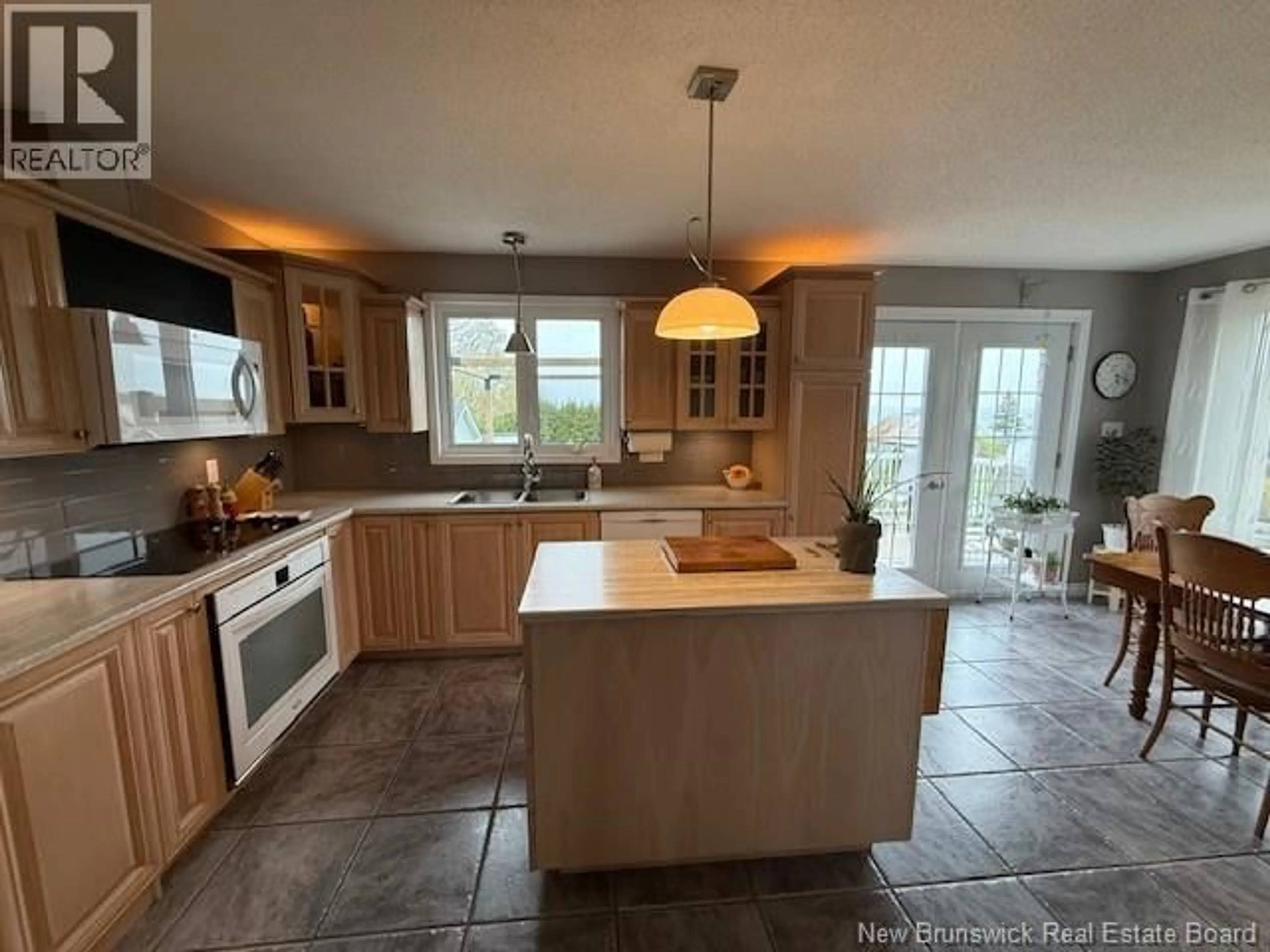 Open concept kitchen, ceramic/tile floor for 469 CHALEUR STREET, Charlo New Brunswick E8E2C1