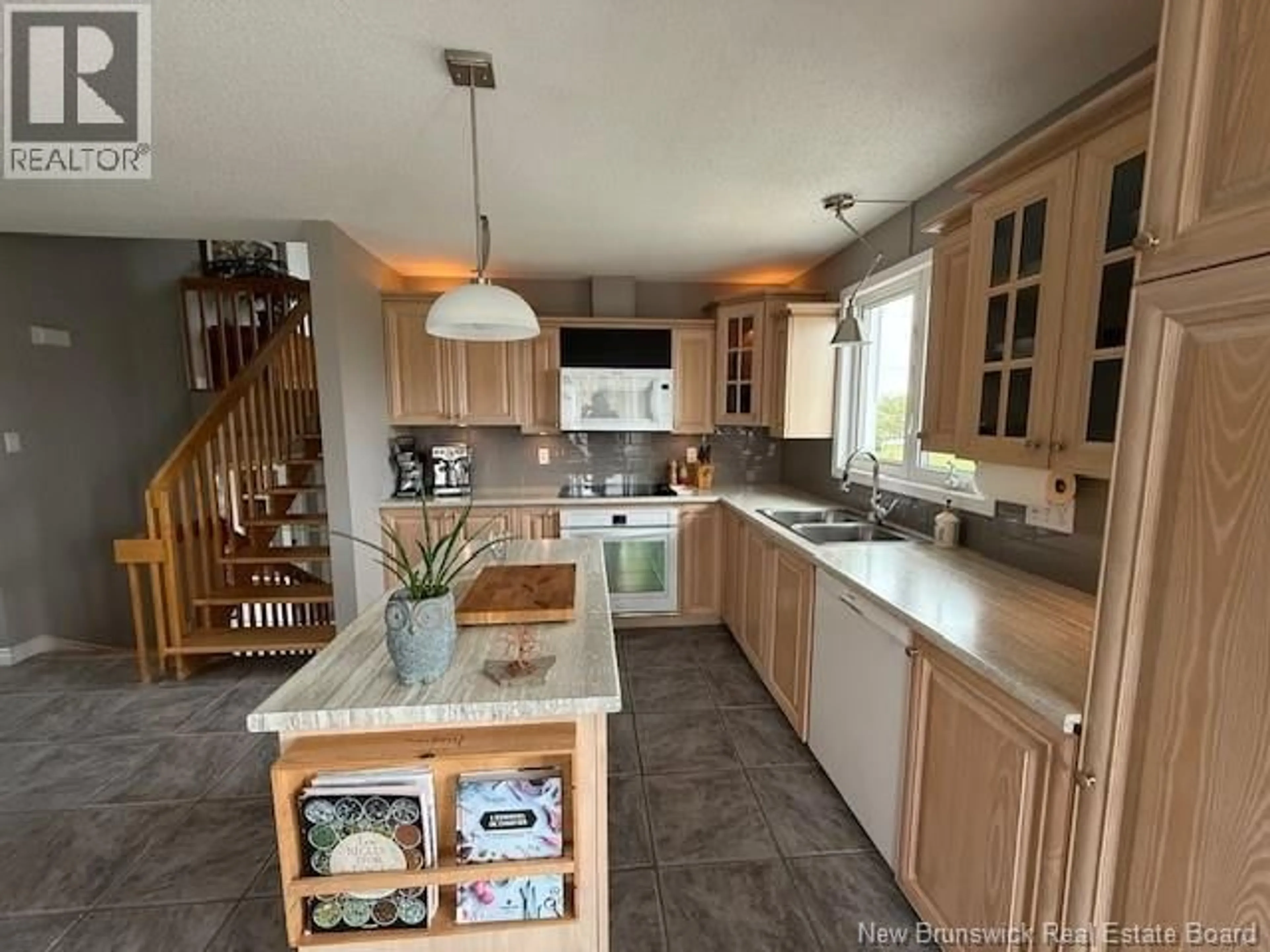 Open concept kitchen, ceramic/tile floor for 469 CHALEUR STREET, Charlo New Brunswick E8E2C1