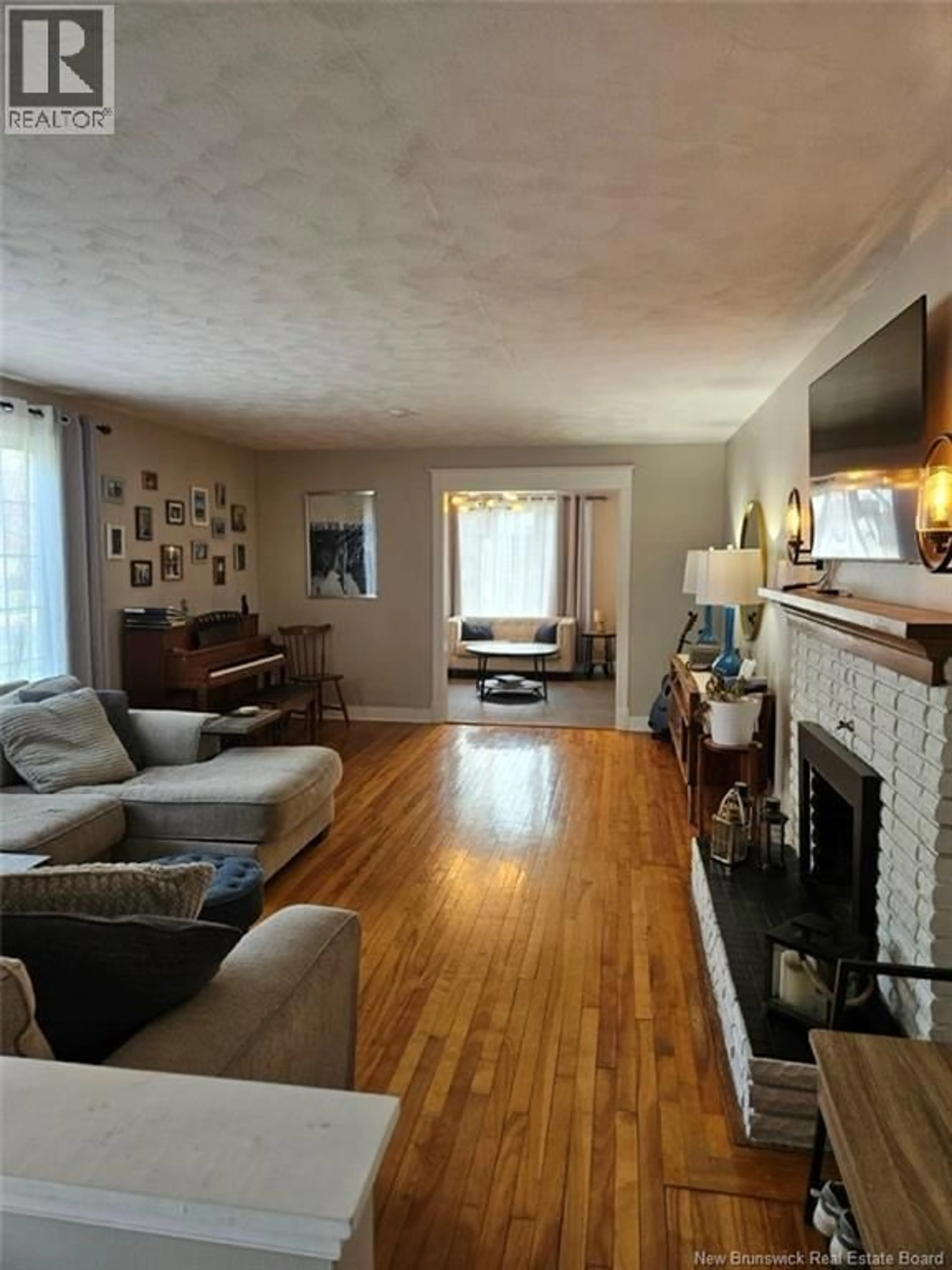 Living room with furniture, wood/laminate floor for 930 O'NEIL AVENUE, Bathurst New Brunswick E2A2L3