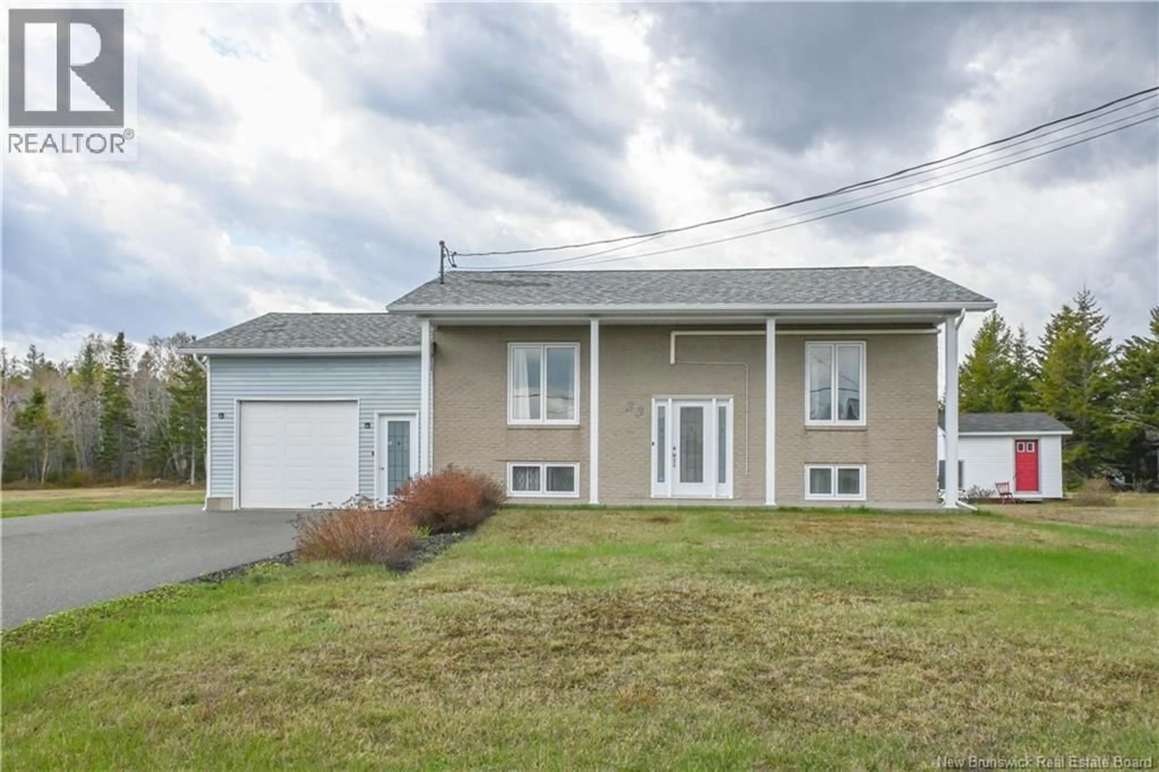 Home with vinyl exterior material, street for 33 DE LA BAIE STREET, Maisonnette New Brunswick E8N2A9