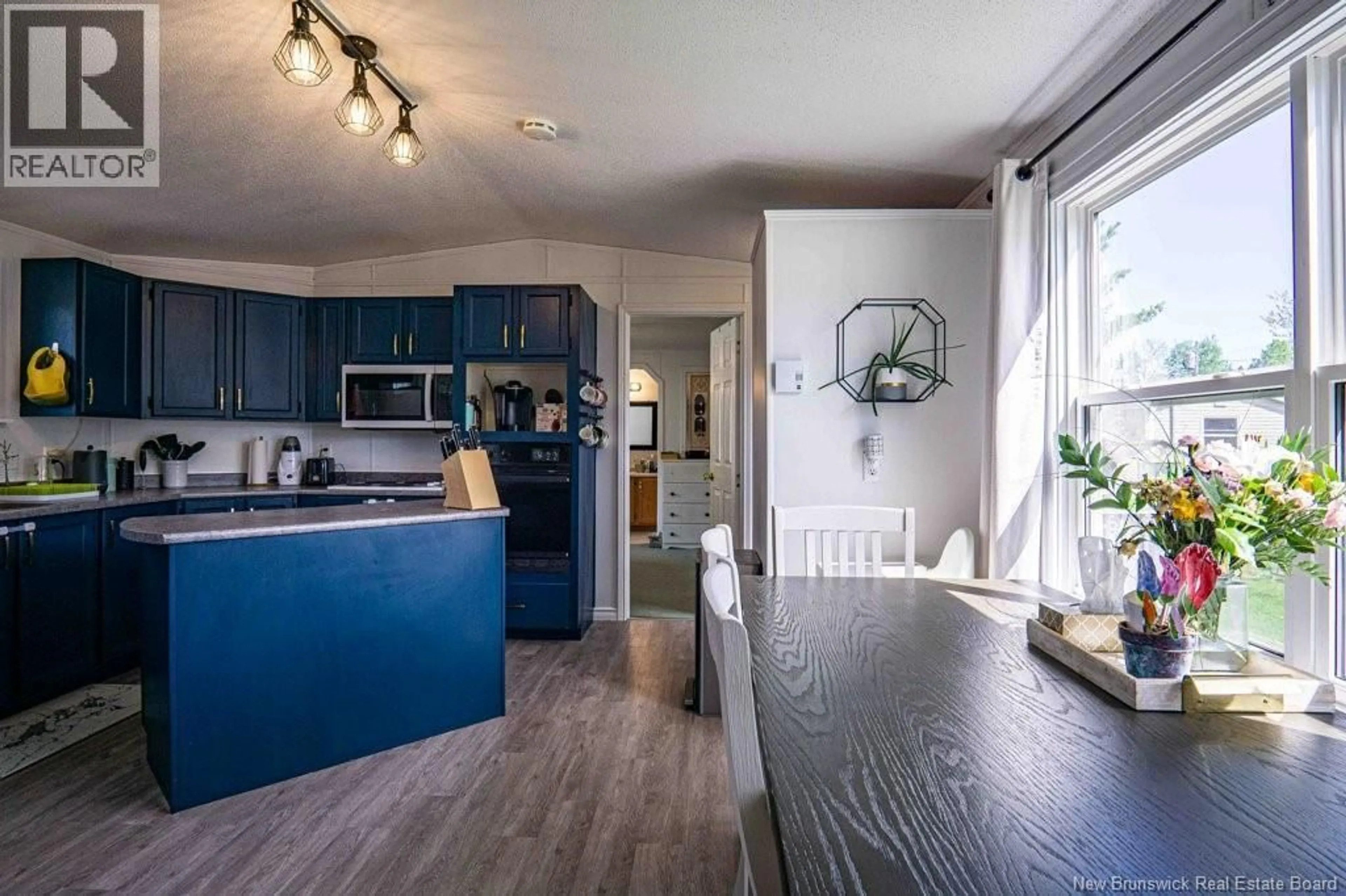 Open concept kitchen, wood/laminate floor for 95 CURRIE CRESCENT, Waasis New Brunswick E3B7H3