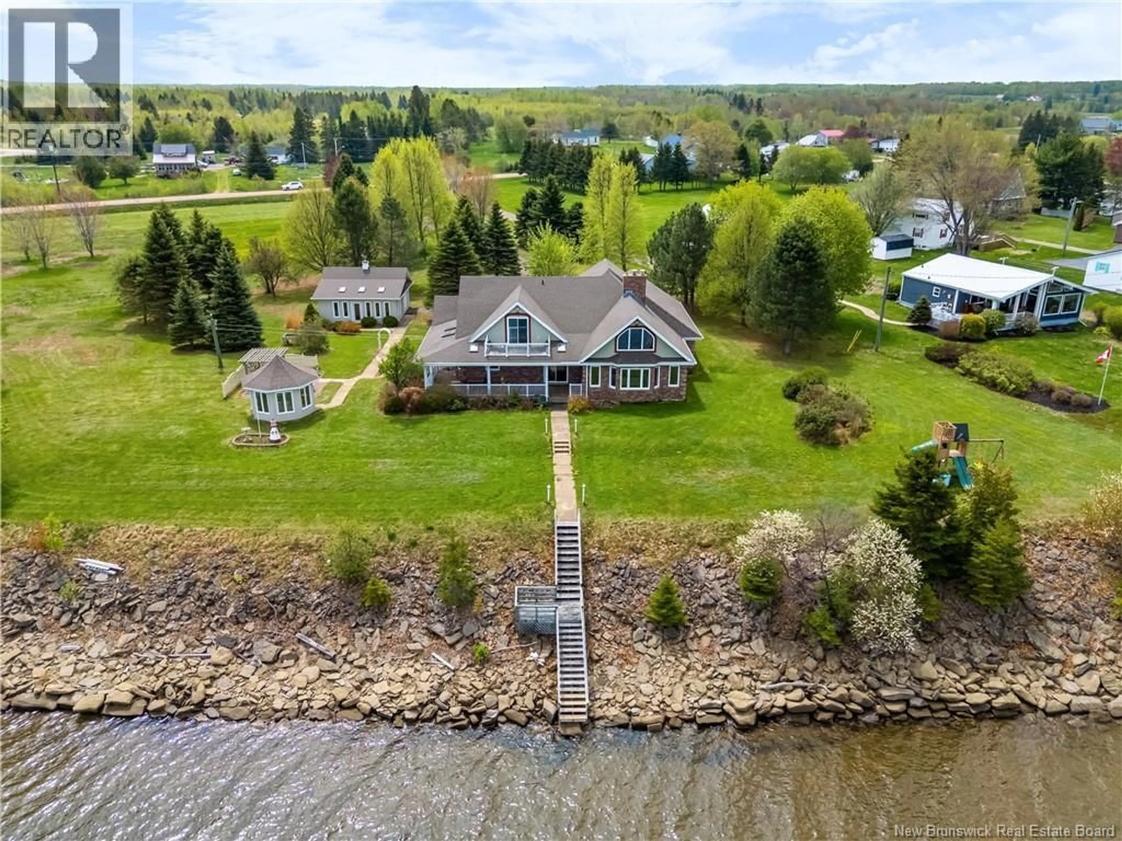 A pic from outside/outdoor area/front of a property/back of a property/a pic from drone, water/lake/river/ocean view for 28 CHEMIN RIVE SUD, Cocagne New Brunswick E4R2X1