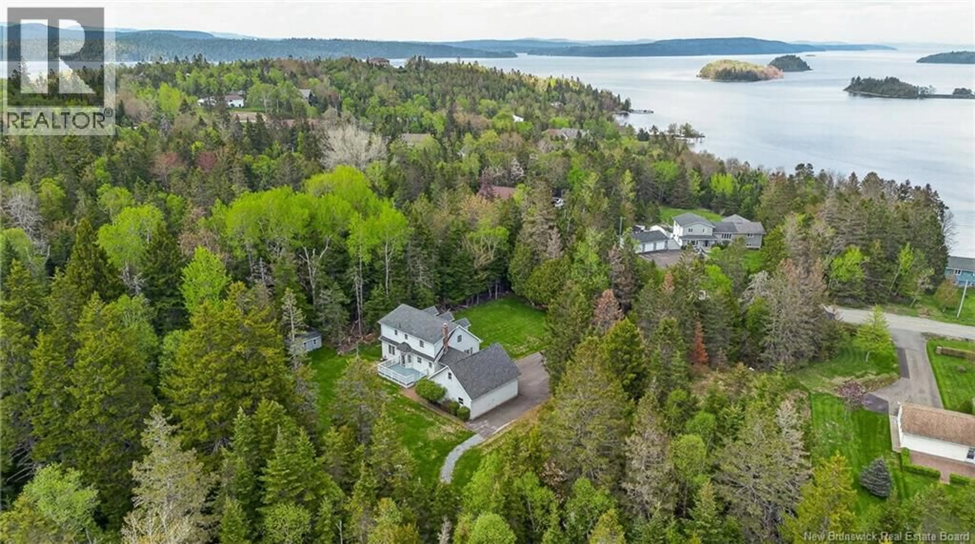 A pic from outside/outdoor area/front of a property/back of a property/a pic from drone, water/lake/river/ocean view for 223 RAGGED POINT ROAD, Saint John New Brunswick E2K5B5