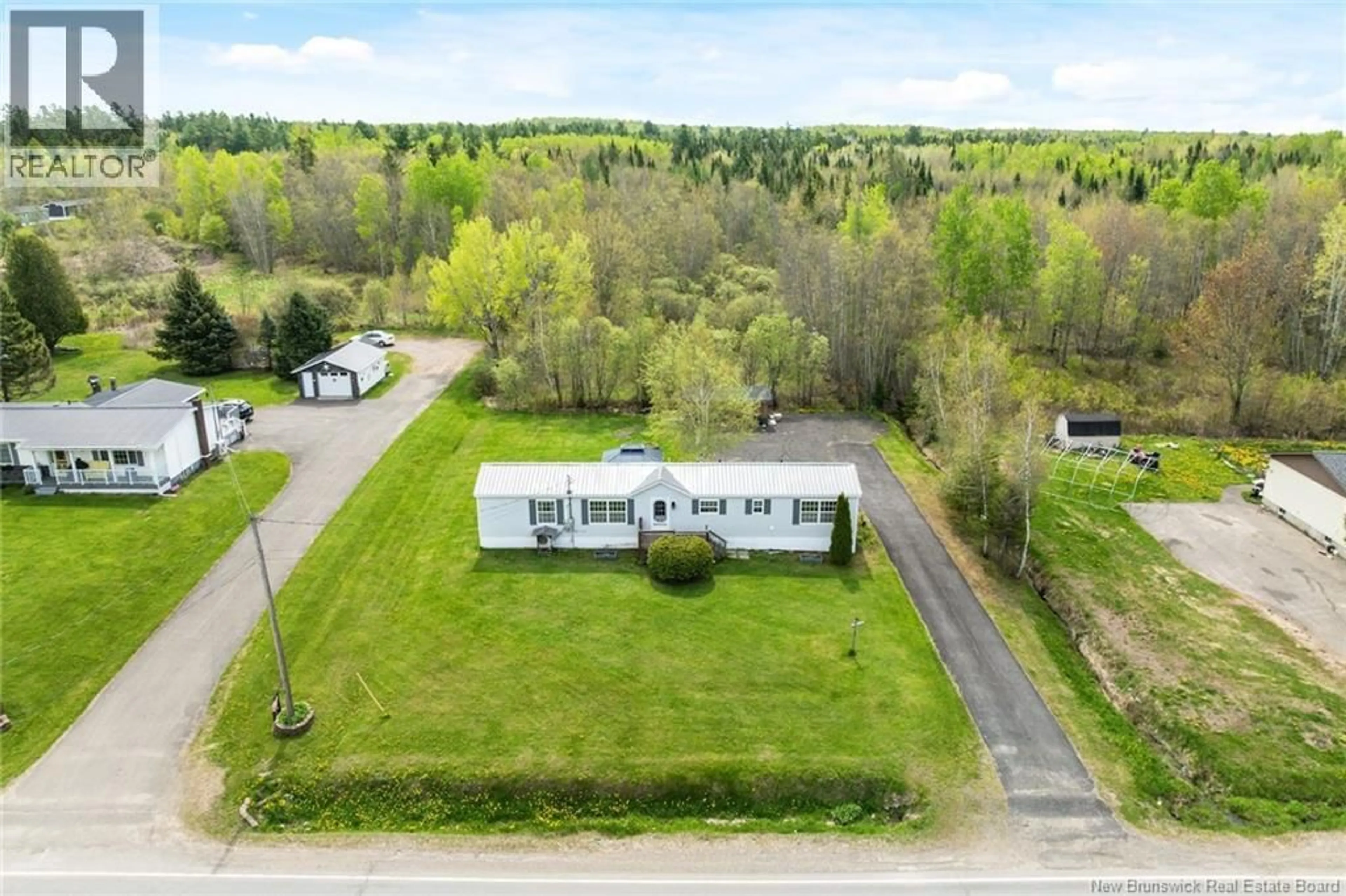 A pic from outside/outdoor area/front of a property/back of a property/a pic from drone, unknown for 589 MAIN ST, Chipman New Brunswick E4A2J1