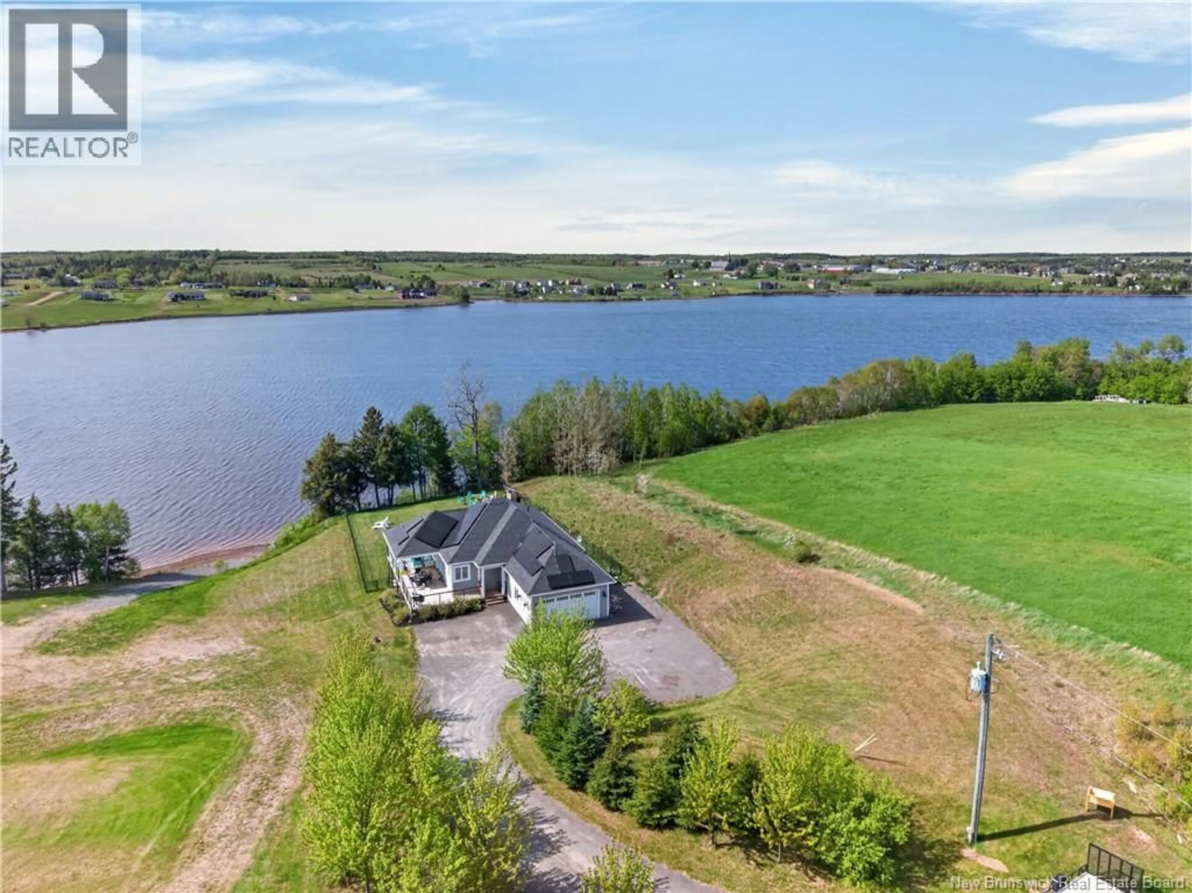 A pic from outside/outdoor area/front of a property/back of a property/a pic from drone, water/lake/river/ocean view for 16 CHARLES A LOUIS LANE, Sainte-Marie-De-Kent New Brunswick E4S0H2