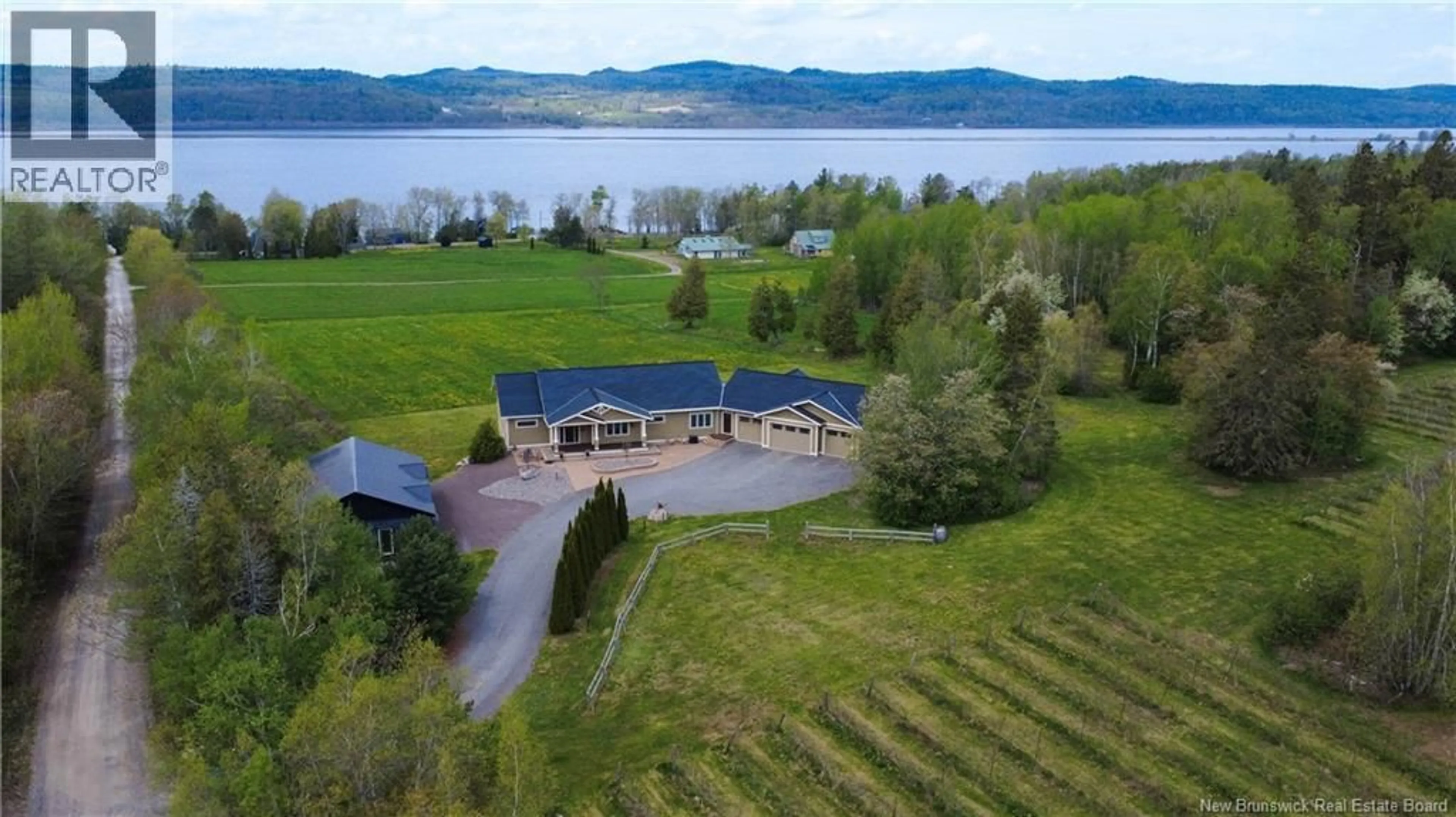A pic from outside/outdoor area/front of a property/back of a property/a pic from drone, water/lake/river/ocean view for 2 DUNHAMS WHARF ROAD, Kingston New Brunswick E5N1A4