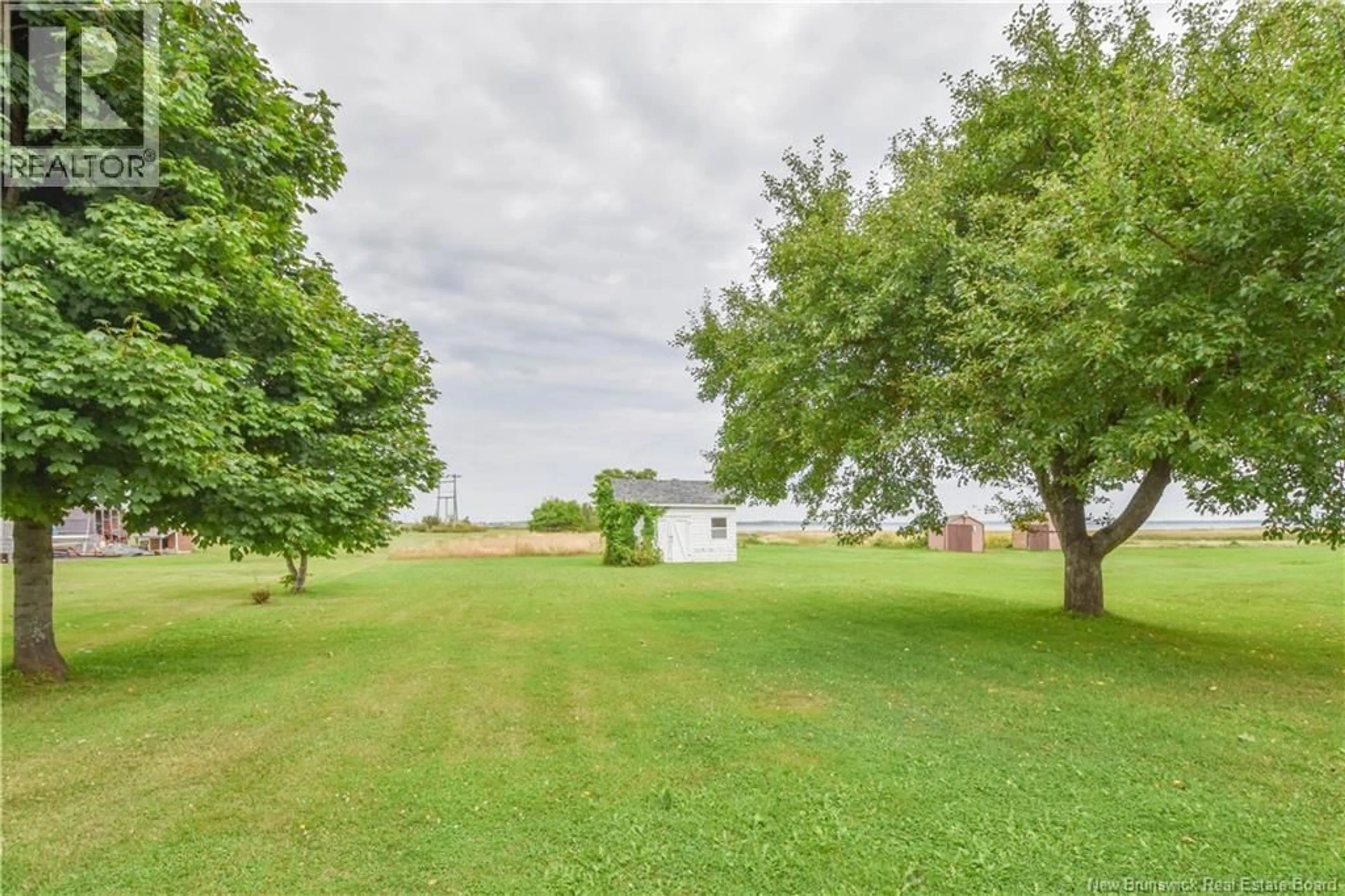 A pic from outside/outdoor area/front of a property/back of a property/a pic from drone, water/lake/river/ocean view for 310 JD GAUTHIER BOULEVARD, Shippagan New Brunswick E8S1R4