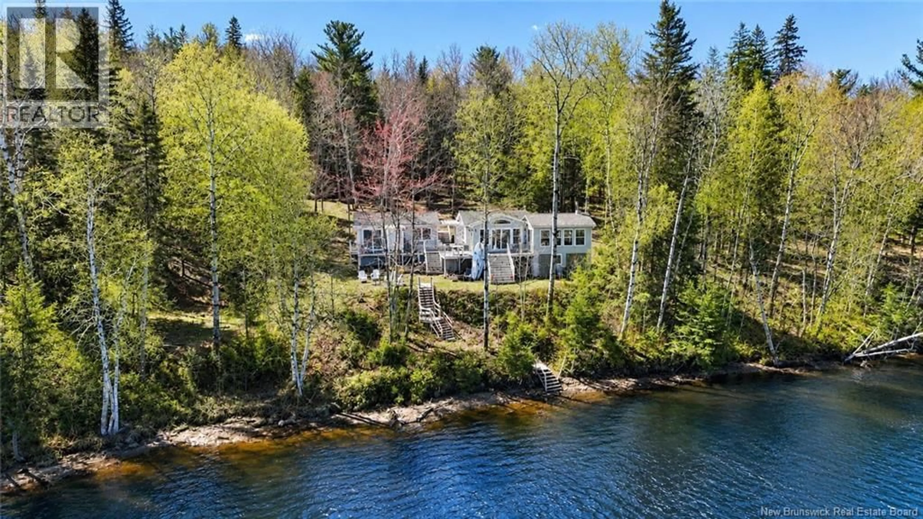A pic from outside/outdoor area/front of a property/back of a property/a pic from drone, water/lake/river/ocean view for 15 LEAMAN, Targettville New Brunswick E4W1W6