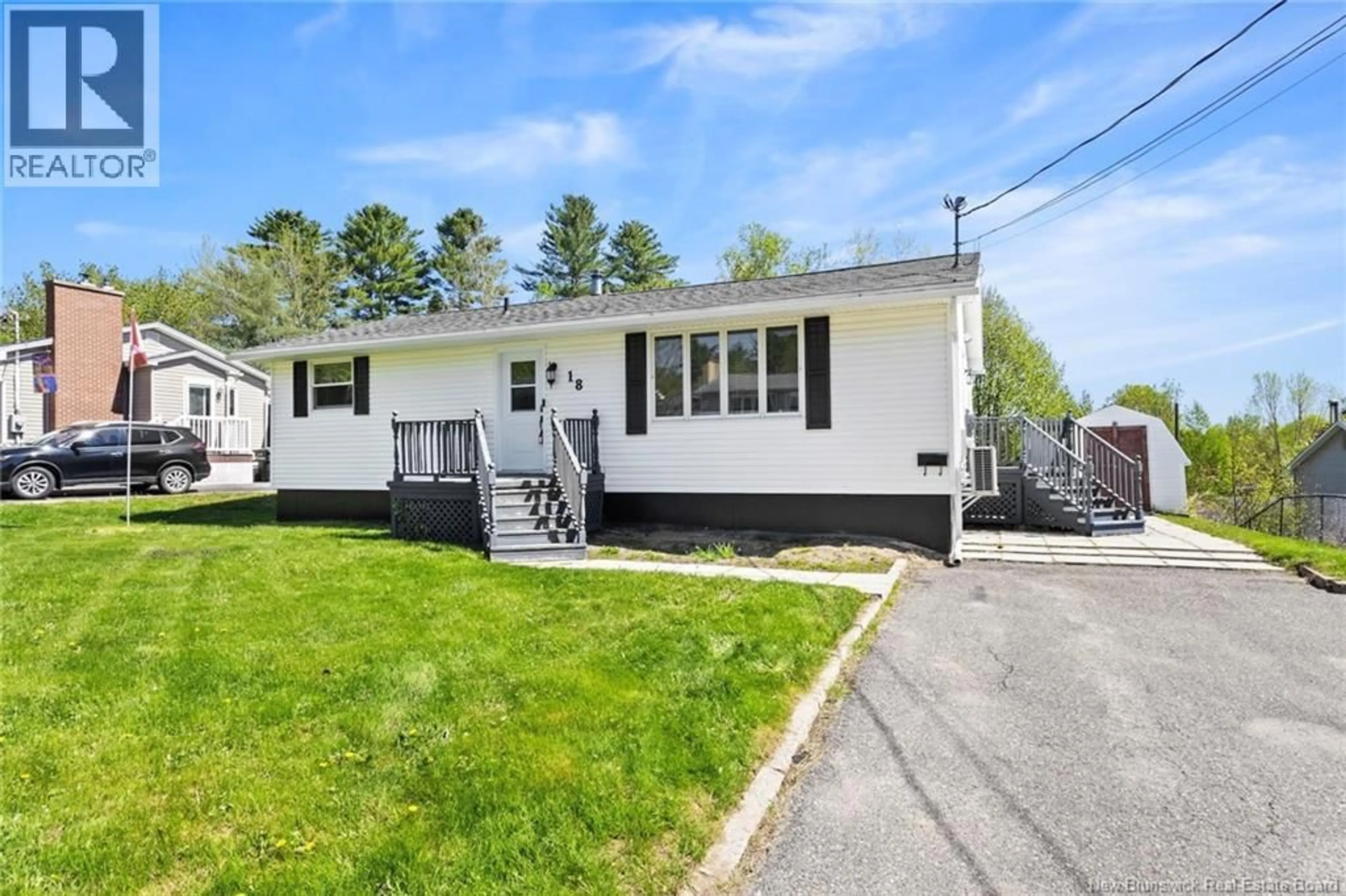 Home with vinyl exterior material, street for 18 HOLLYBROOK STREET, Fredericton New Brunswick E3A4N7