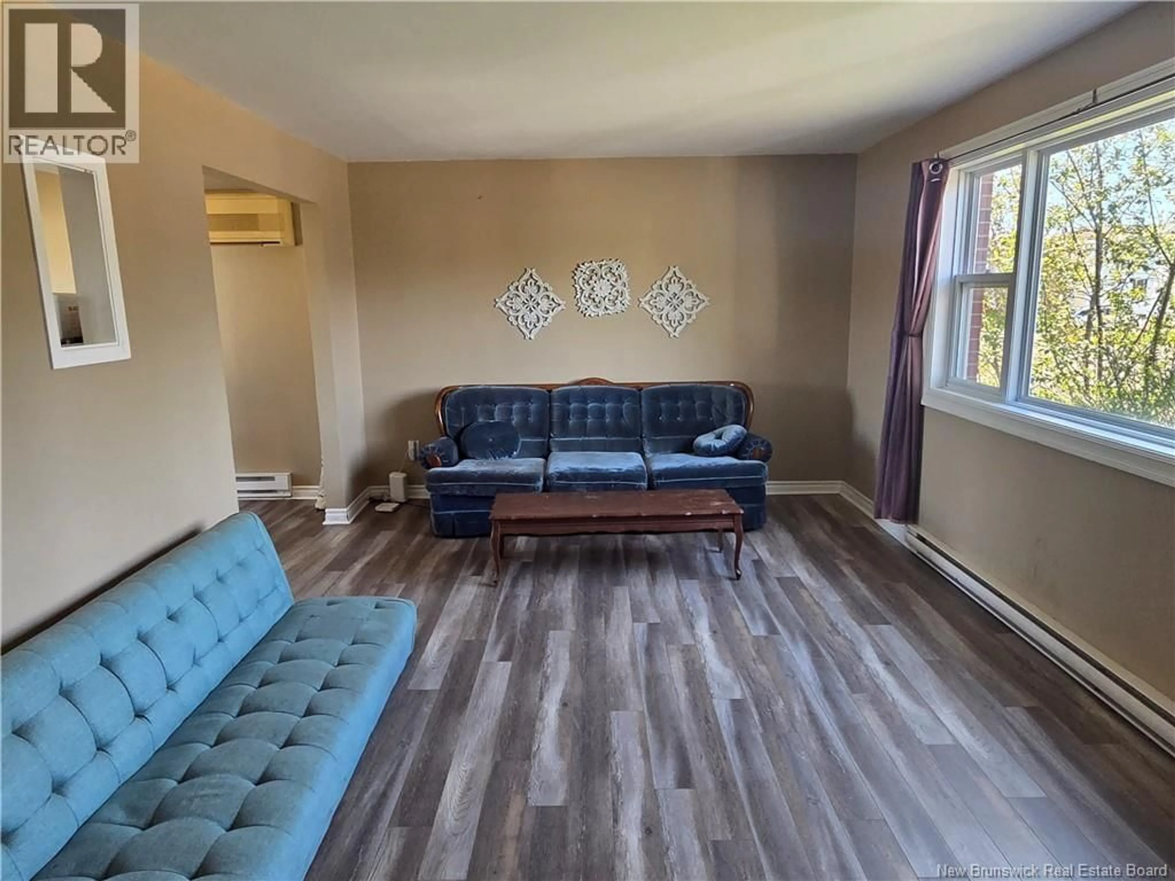 Living room with furniture, wood/laminate floor for 19 ANNE STREET, Moncton New Brunswick E1C4J4
