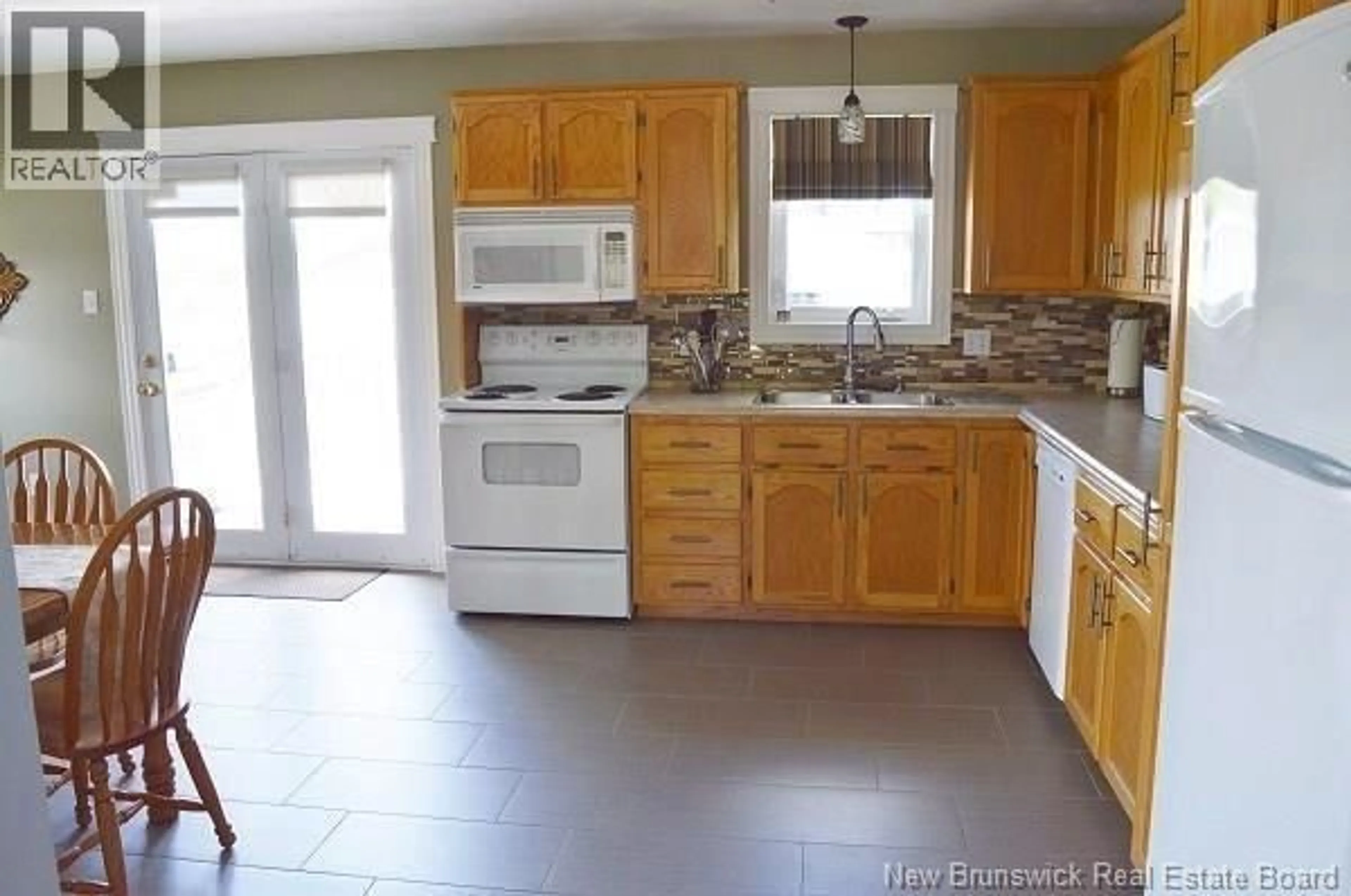 Open concept kitchen, ceramic/tile floor for 10 KING STREET, Shediac New Brunswick E4P1X9