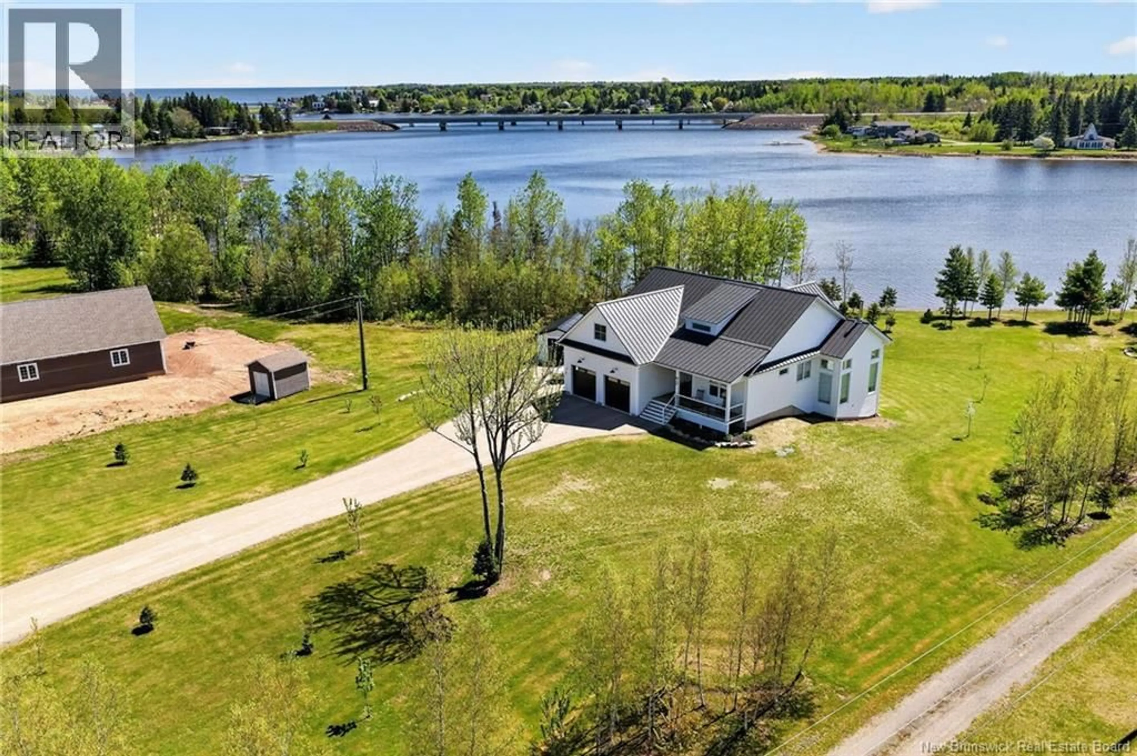 A pic from outside/outdoor area/front of a property/back of a property/a pic from drone, water/lake/river/ocean view for 92 WATERFRONT, Shediac River New Brunswick E4R0G1