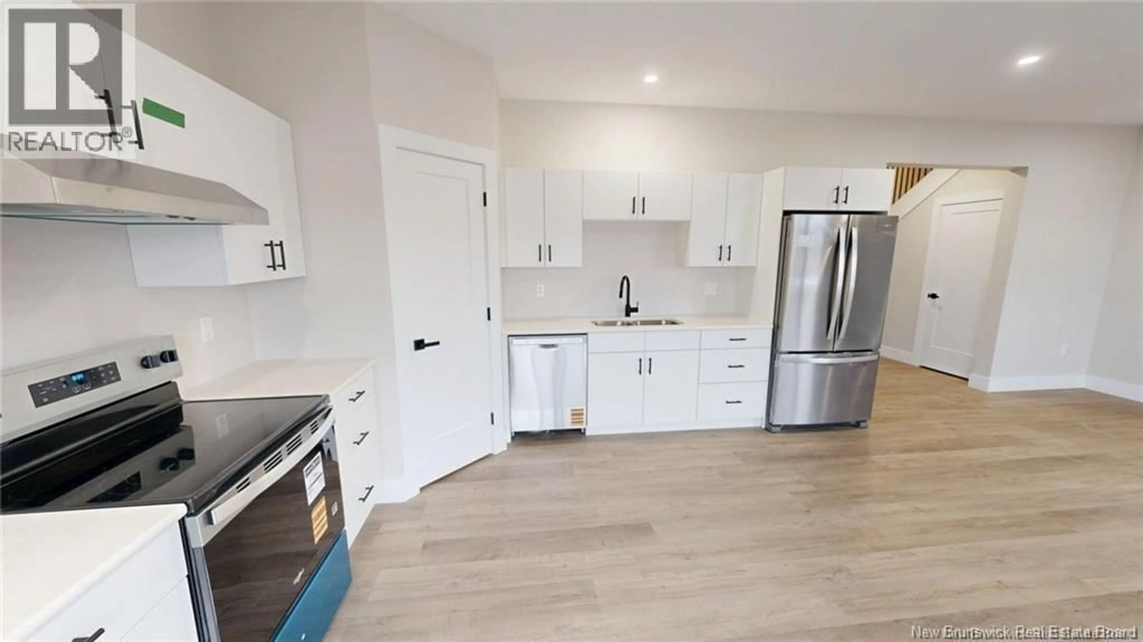 Open concept kitchen, wood/laminate floor for 40 OCEAN DRIVE, Saint John New Brunswick E2P1G4