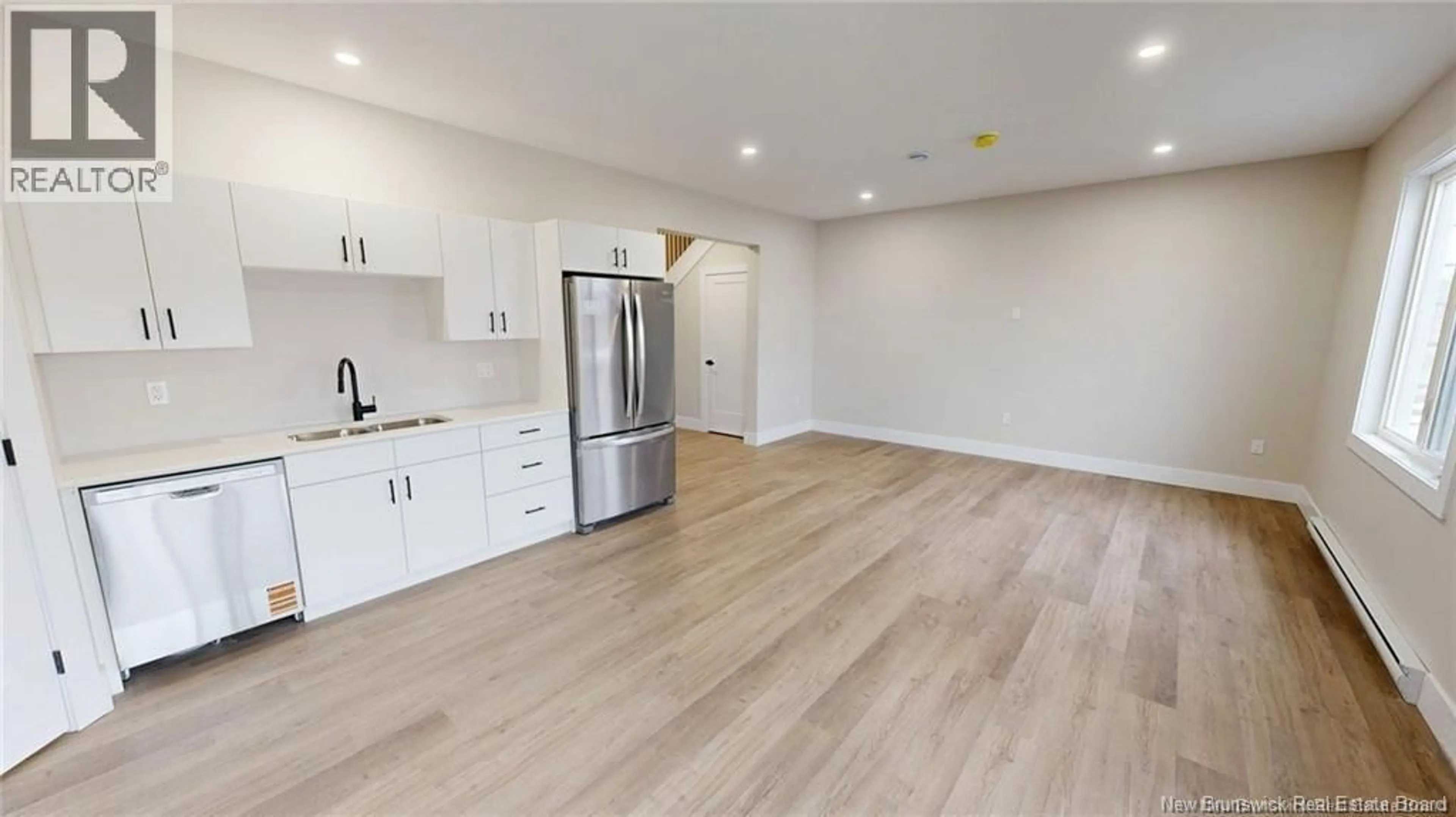 Open concept kitchen, wood/laminate floor for 40 OCEAN DRIVE, Saint John New Brunswick E2P1G4