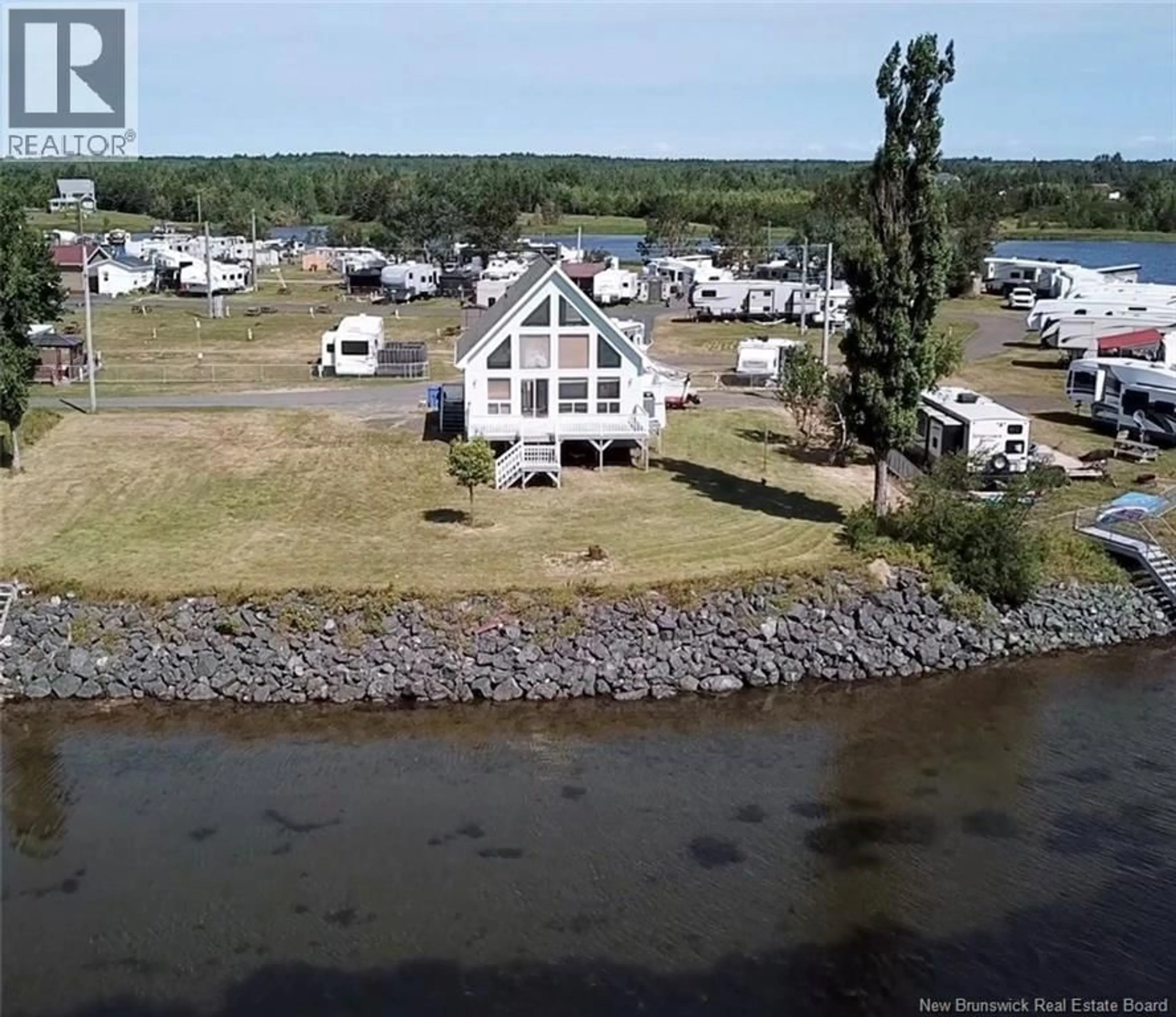 A pic from outside/outdoor area/front of a property/back of a property/a pic from drone, water/lake/river/ocean view for 82 DE LA POINTE ROAD, Haut-Sheila New Brunswick E1X3T8