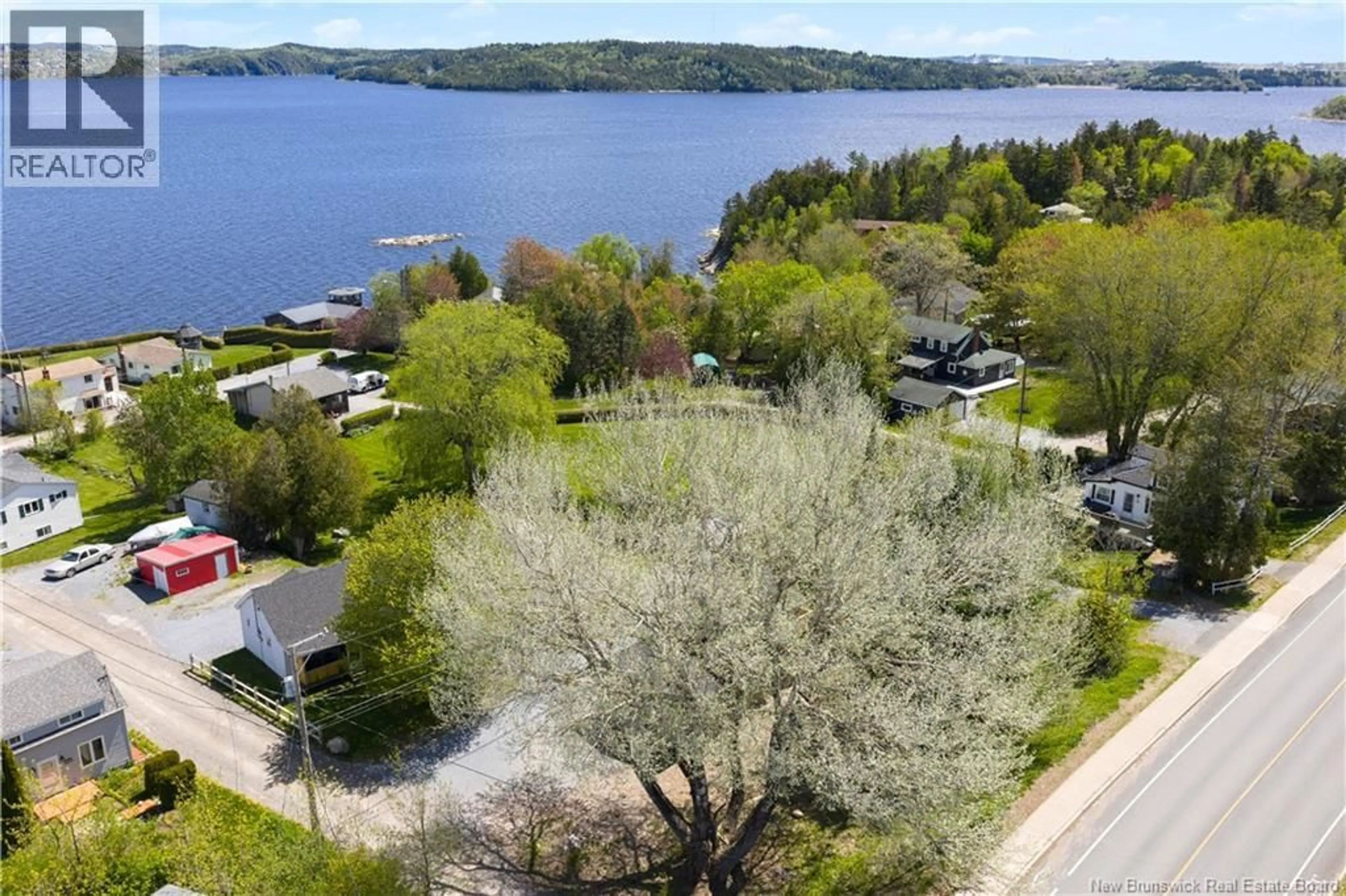 A pic from outside/outdoor area/front of a property/back of a property/a pic from drone, water/lake/river/ocean view for 4 BY ROAD NO. 2 ROAD, Saint John New Brunswick E2M6G8