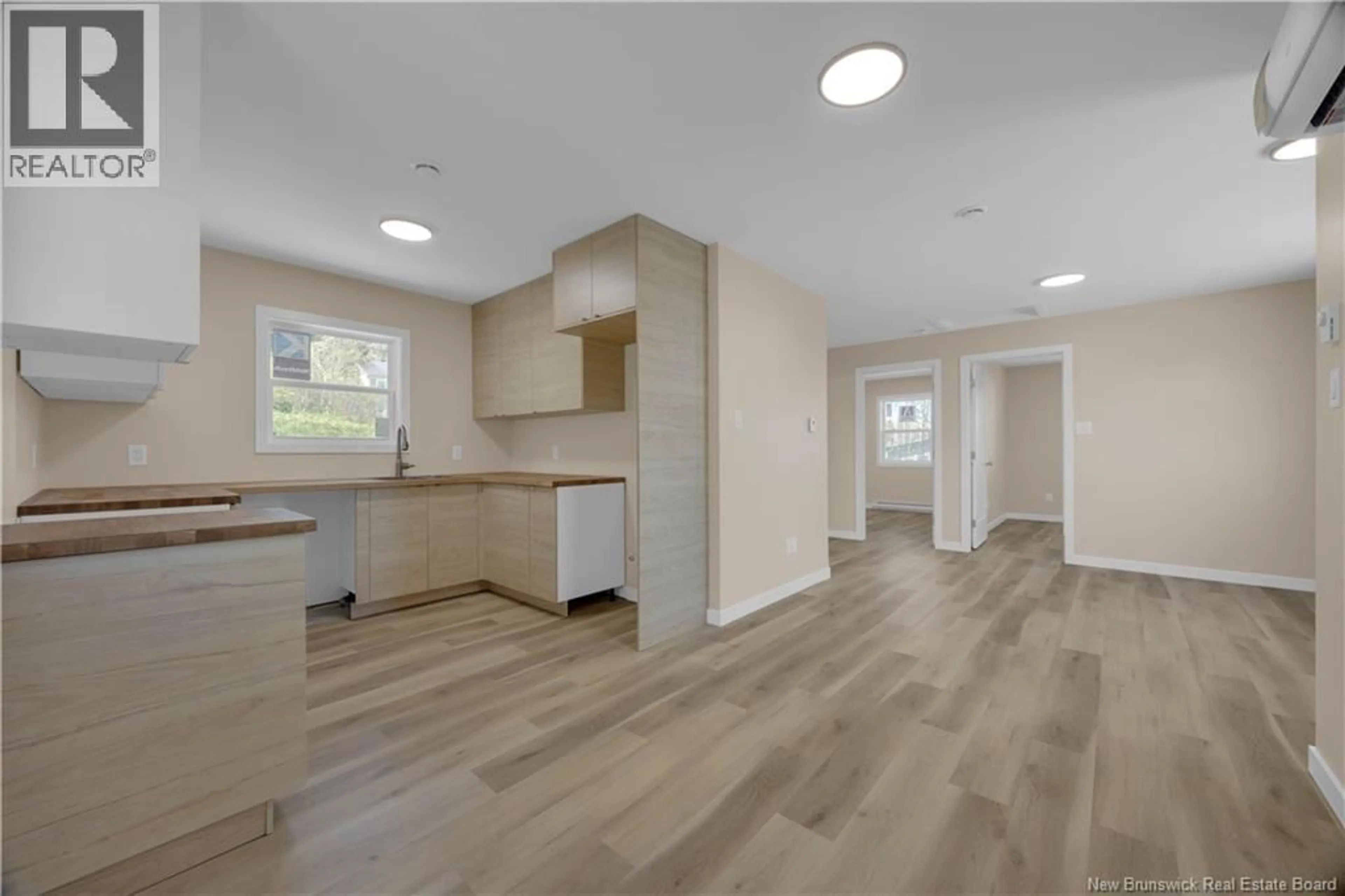 Open concept kitchen, wood/laminate floor for 4 BY ROAD NO. 2 ROAD, Saint John New Brunswick E2M6G8