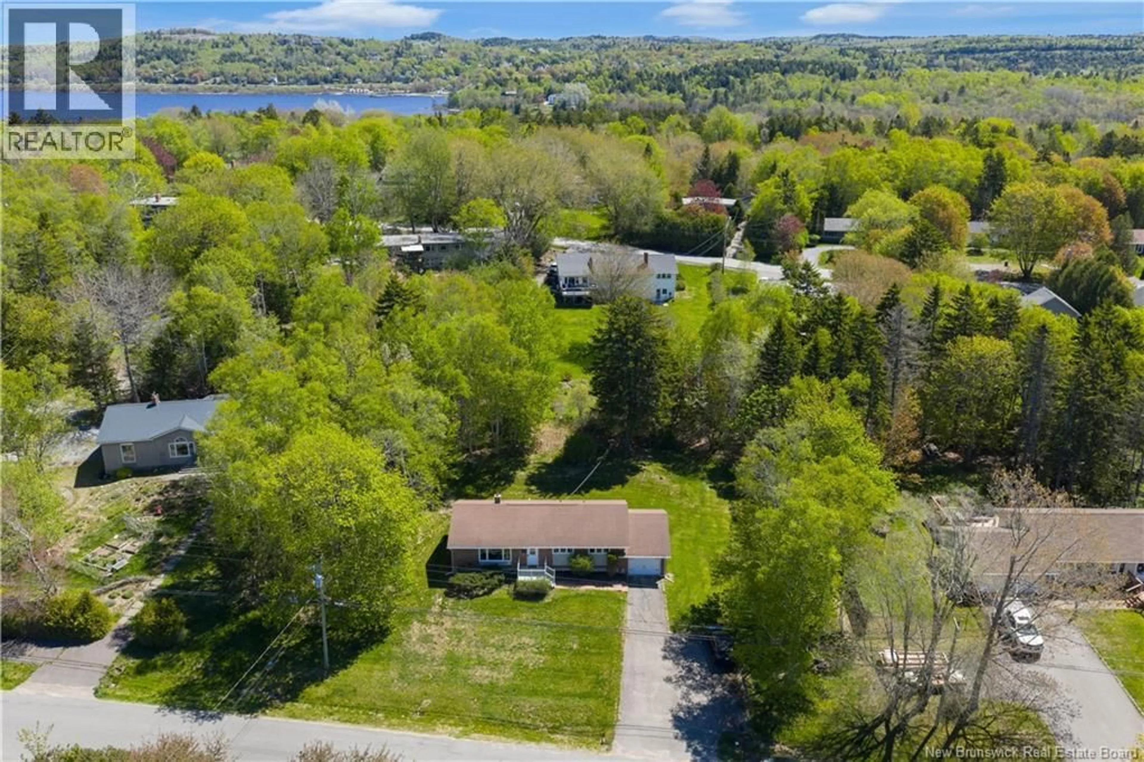 A pic from outside/outdoor area/front of a property/back of a property/a pic from drone, water/lake/river/ocean view for 68 ELIZABETH PARKWAY, Rothesay New Brunswick E2H1E9