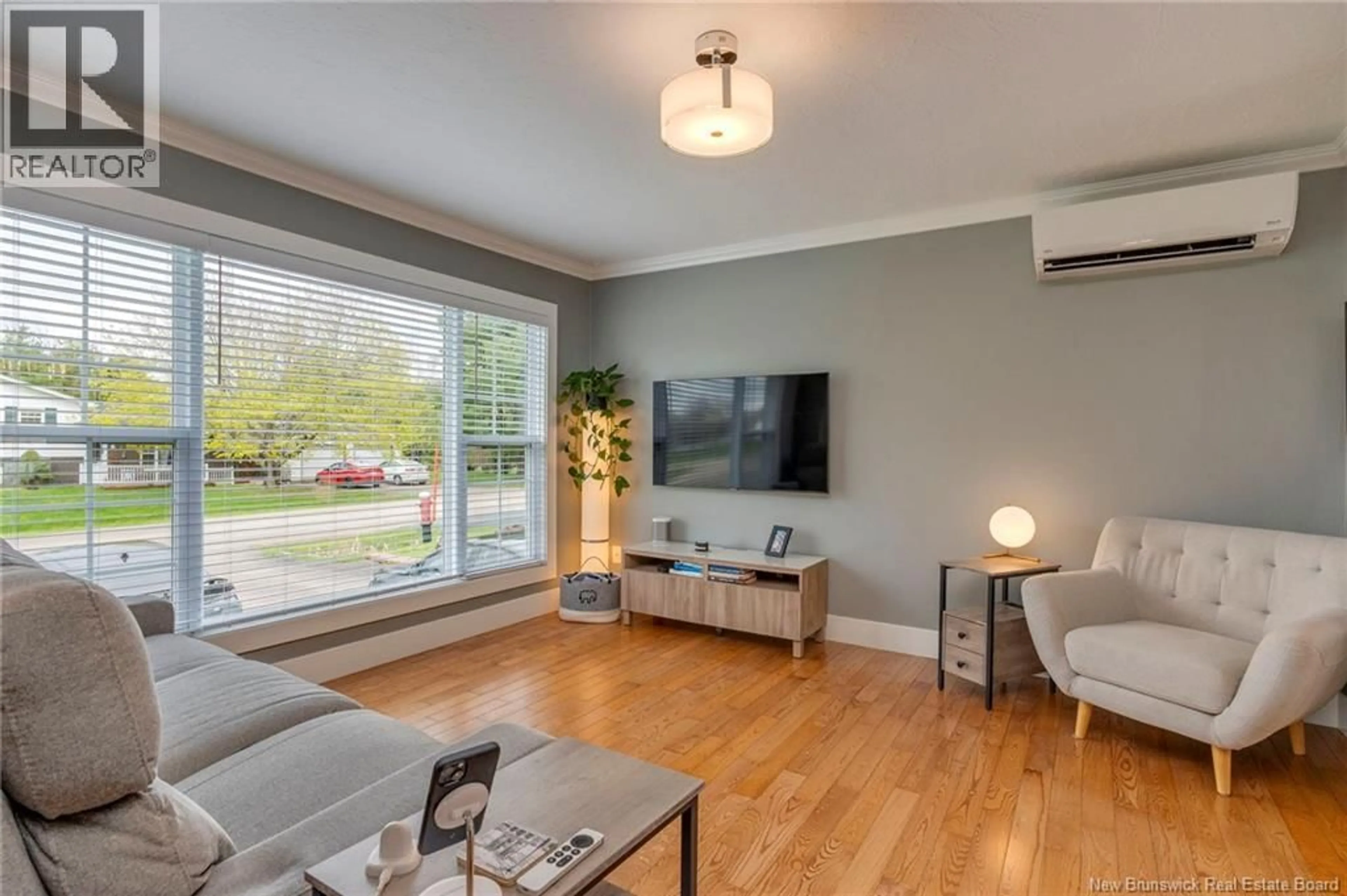 Living room with furniture, wood/laminate floor for 14 CHESTNUT CRESCENT, Lutes Mountain New Brunswick E1G2S4