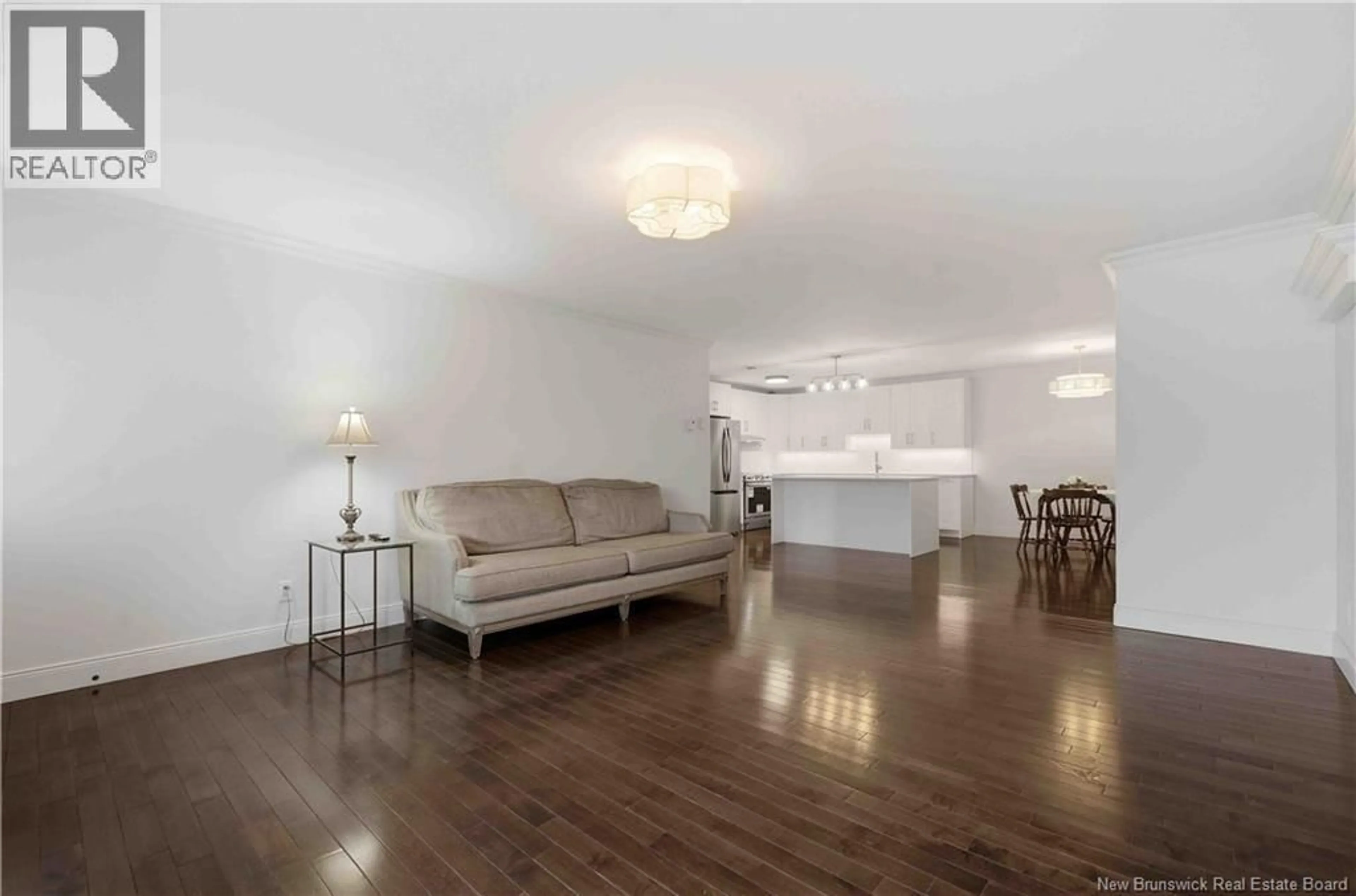 Living room with furniture, wood/laminate floor for 207 - 9 SUNNY BRAE DRIVE, Devon New Brunswick E3A8H4