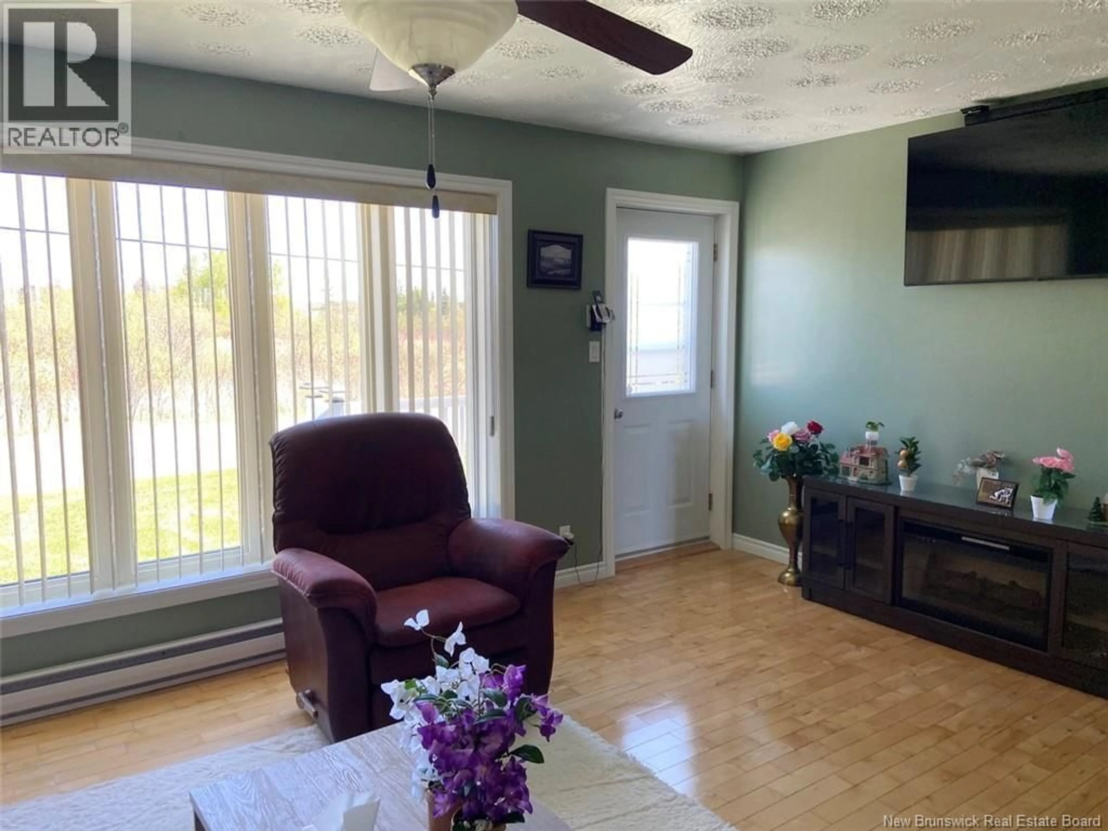 Living room with furniture, wood/laminate floor for 20 SIROIS ROAD, Sainte-Anne-De-Madawaska New Brunswick E7E1H9