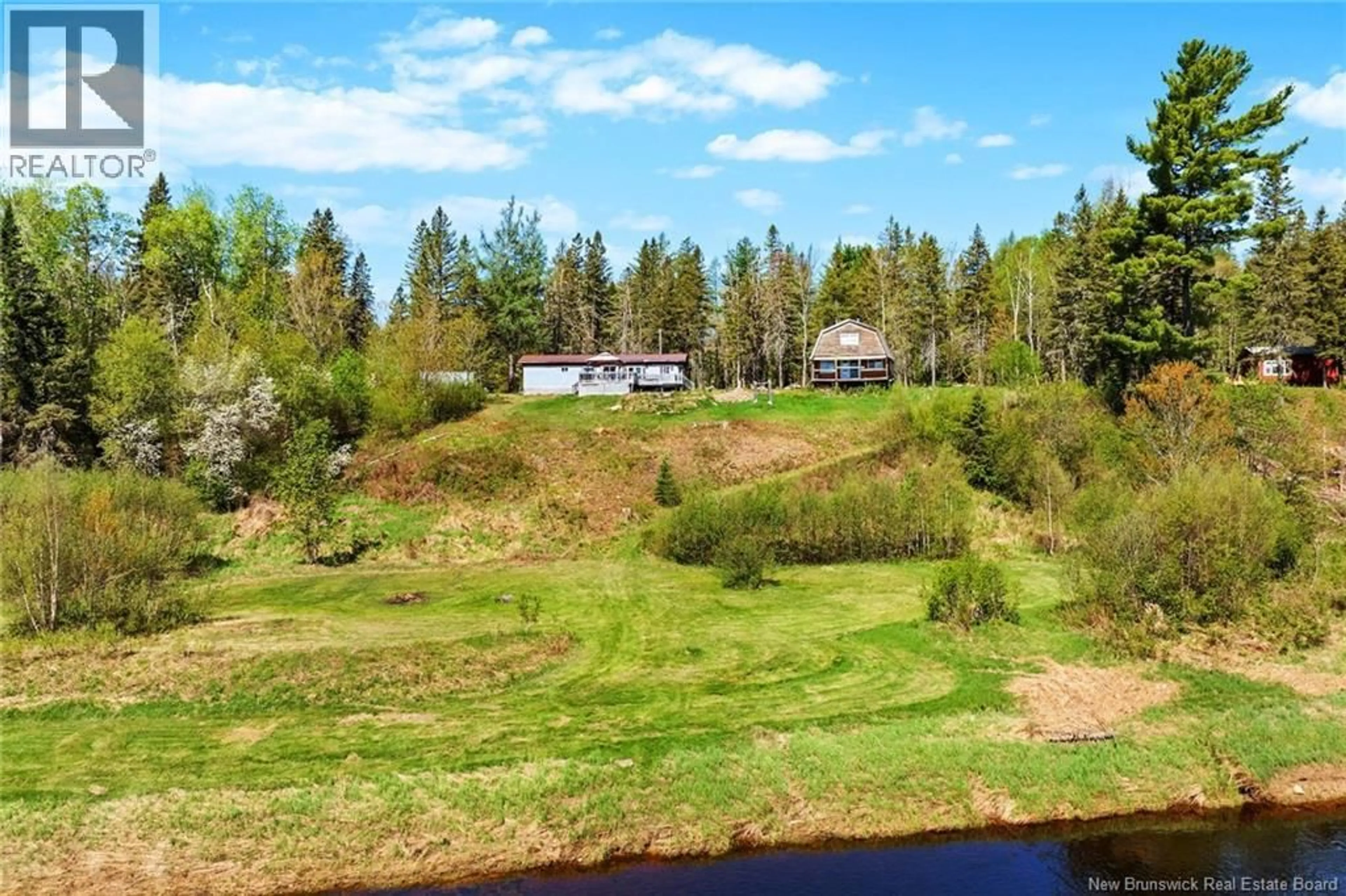 A pic from outside/outdoor area/front of a property/back of a property/a pic from drone, water/lake/river/ocean view for 1500 RTE 116, Salmon River Rd New Brunswick E4A1H4