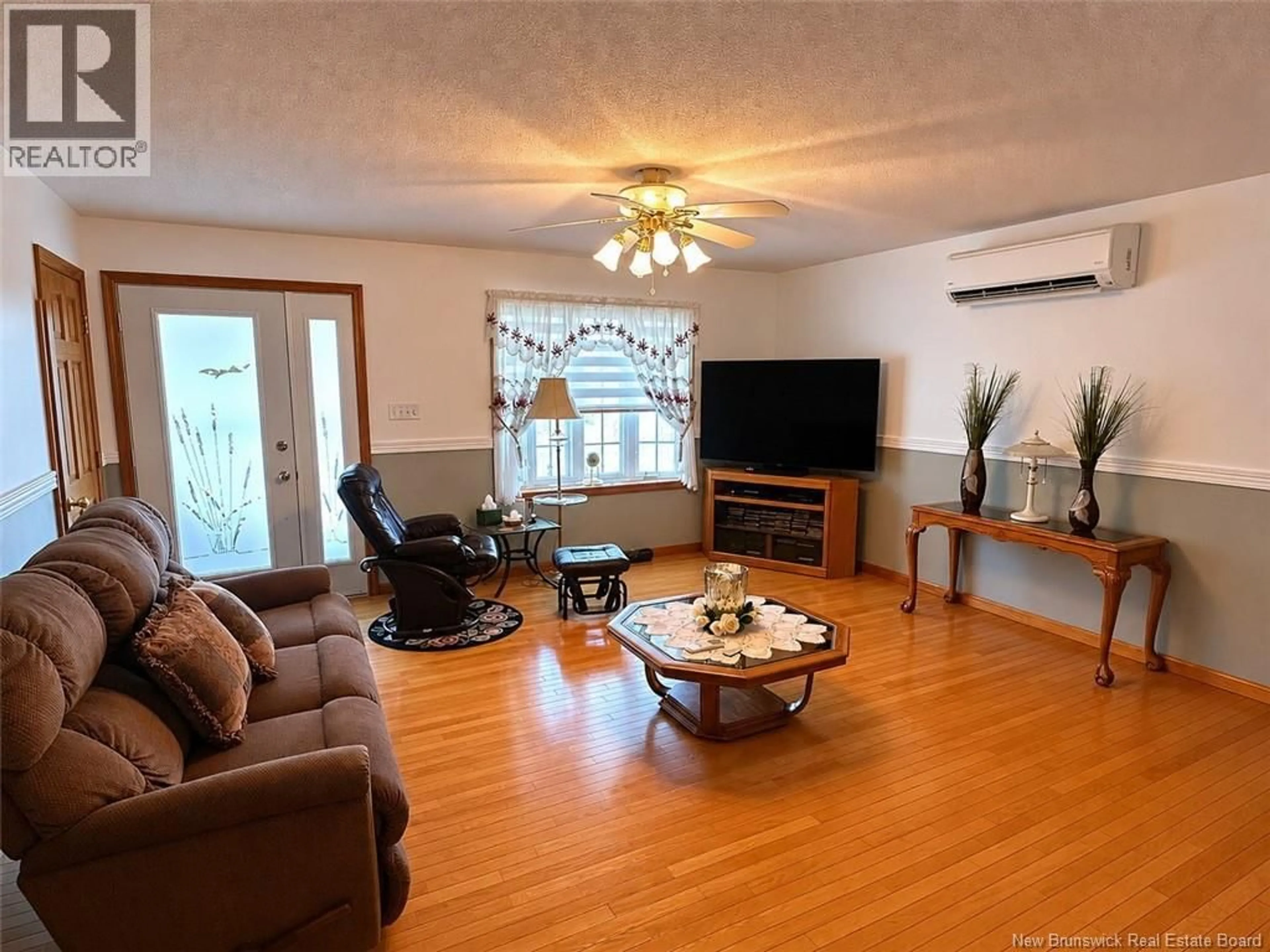 Living room with furniture, wood/laminate floor for 3759 ROUTE 205 ROAD, Saint-François-de-Madawaska New Brunswick E7A1S1