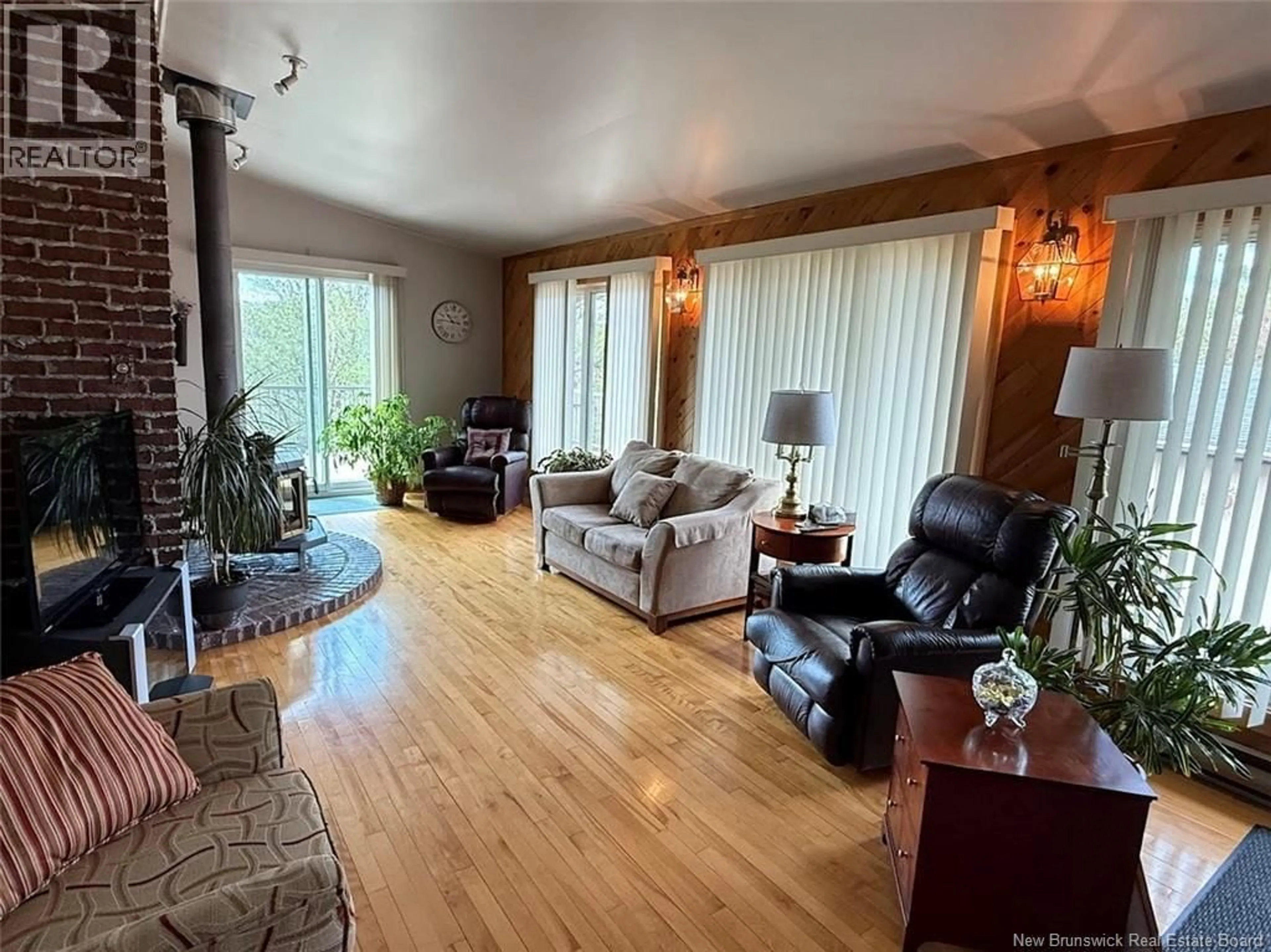 Living room with furniture, wood/laminate floor for 40 GUERRETTE STREET, Edmundston New Brunswick E3V1N8