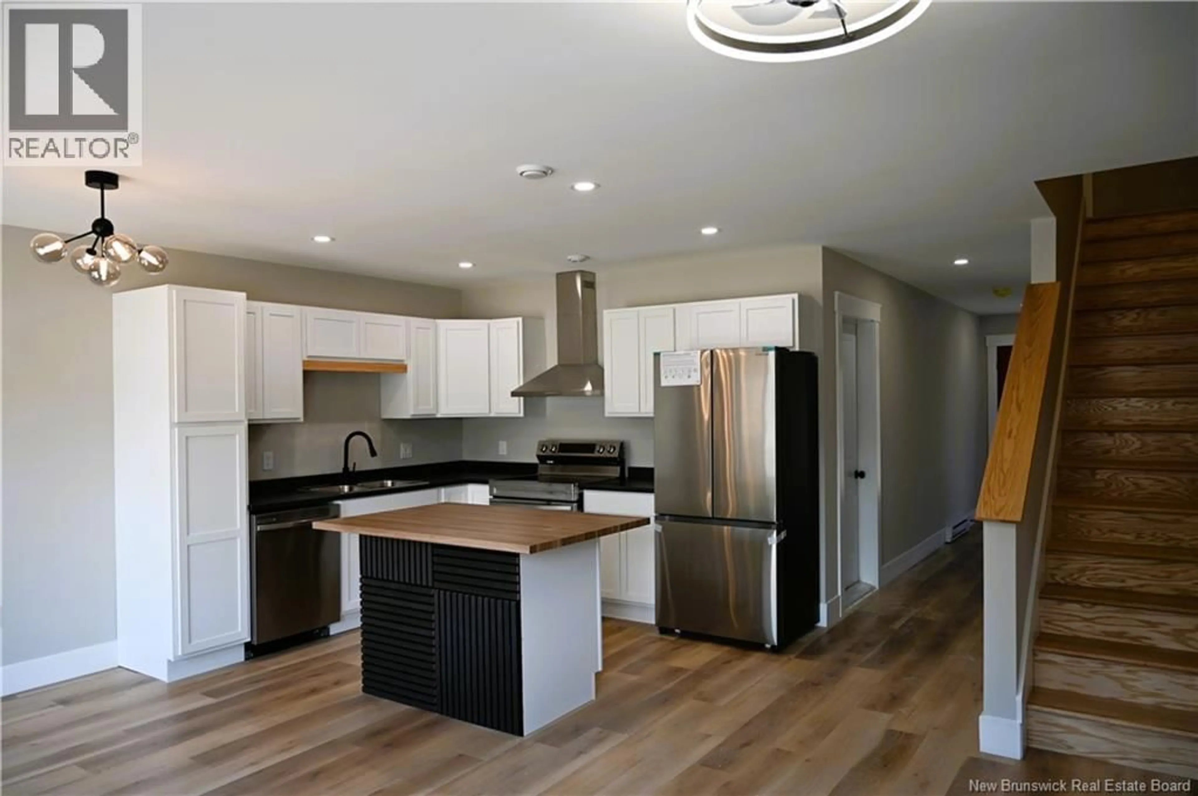 Open concept kitchen, wood/laminate floor for 27 ARLINGTON CRESCENT, Saint John New Brunswick E2K0G4