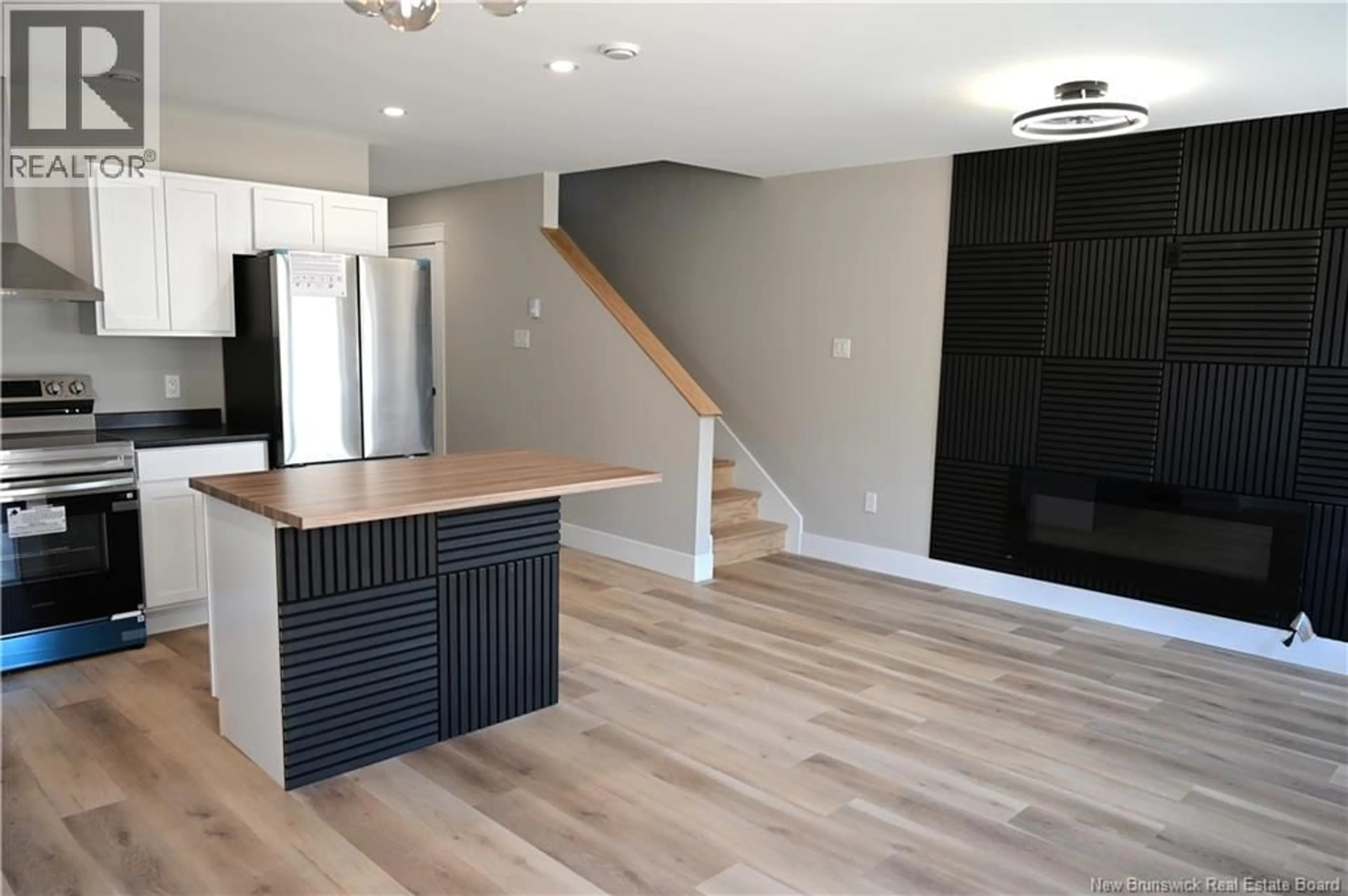 Open concept kitchen, wood/laminate floor for 27 ARLINGTON CRESCENT, Saint John New Brunswick E2K0G4