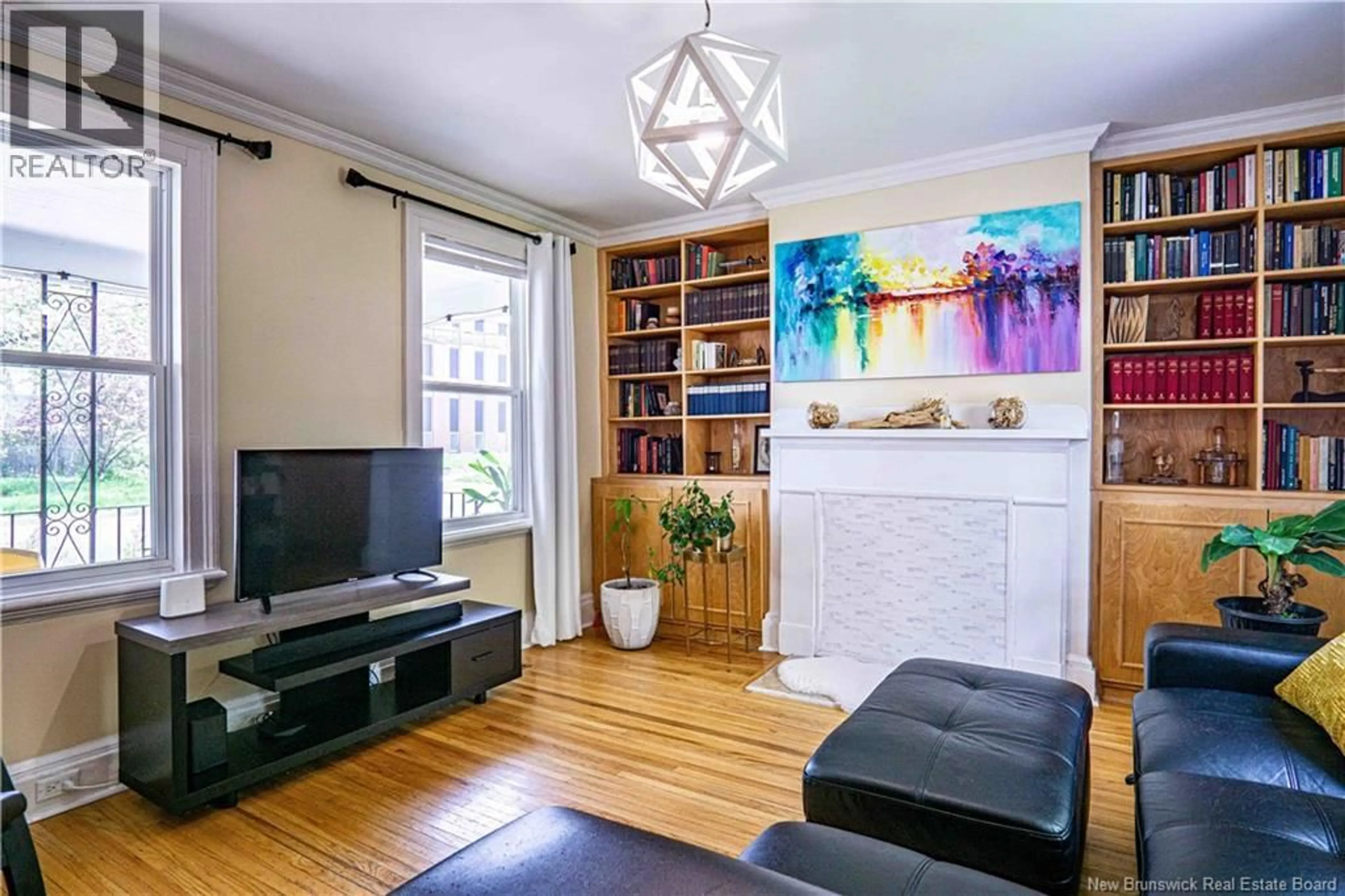 Living room with furniture, wood/laminate floor for 576 CHARLOTTE STREET, Fredericton New Brunswick E3B1M2
