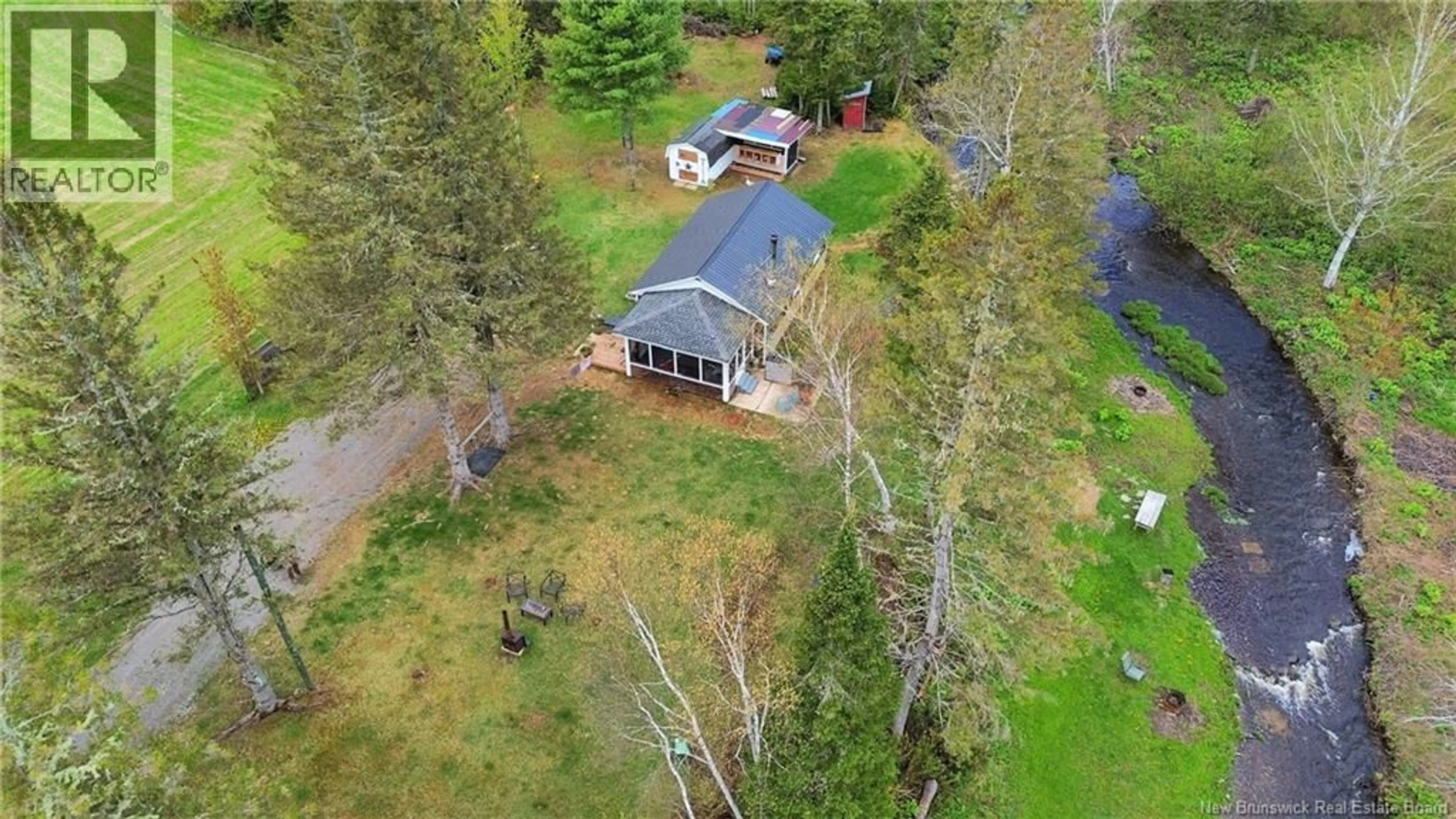 A pic from outside/outdoor area/front of a property/back of a property/a pic from drone, unknown for 15 NORTH RIDGE ROAD, Foreston New Brunswick E7L1K4