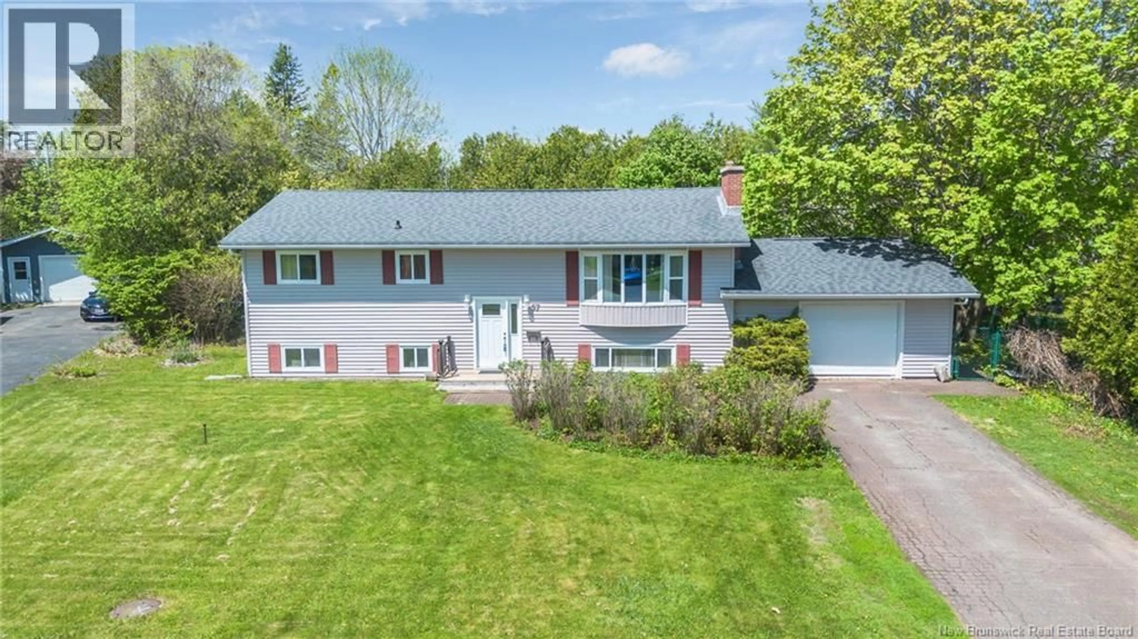 A pic from outside/outdoor area/front of a property/back of a property/a pic from drone, street for 57 OLIVER CRESCENT, New Maryland New Brunswick E3C1E2