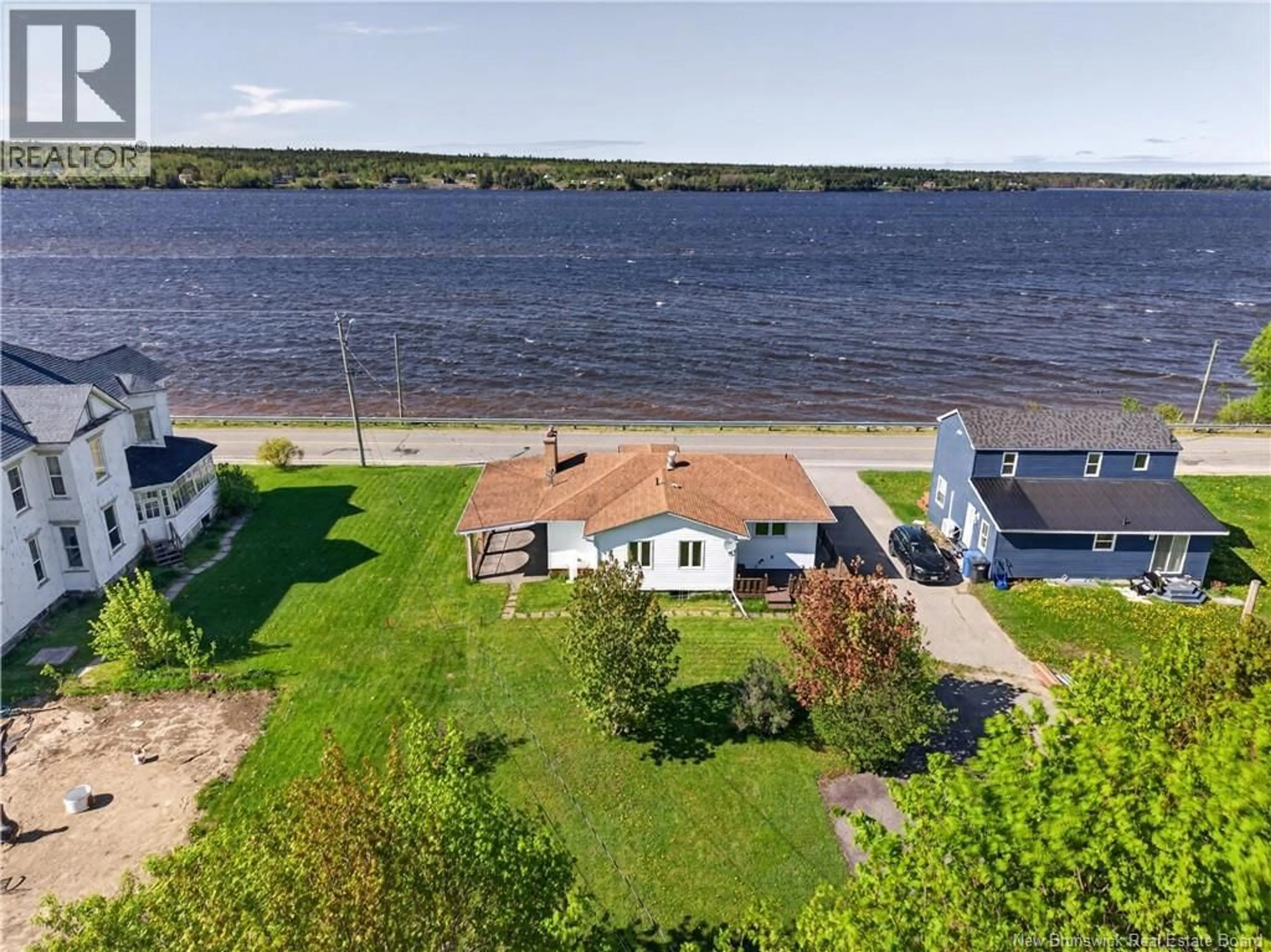A pic from outside/outdoor area/front of a property/back of a property/a pic from drone, water/lake/river/ocean view for 4436 WATER STREET, Miramichi New Brunswick E2S1B3