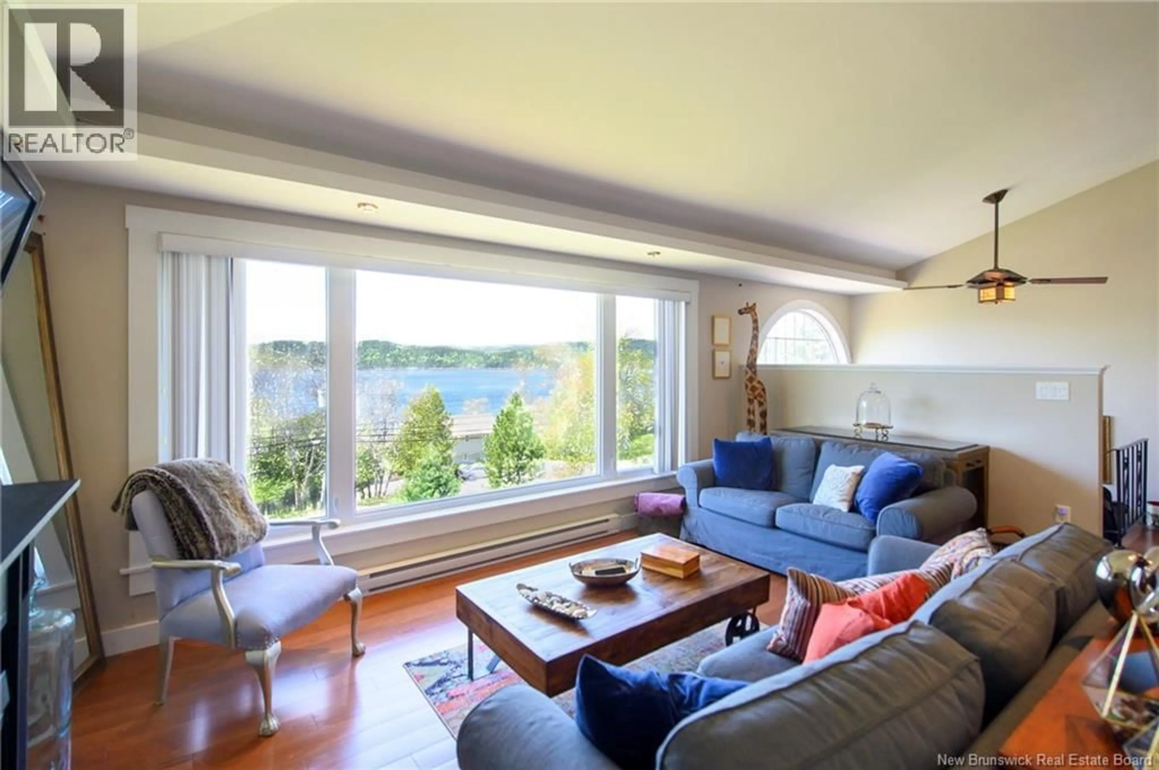 Living room with furniture, wood/laminate floor for 462 GONDOLA POINT ROAD, Quispamsis New Brunswick E2E1E2