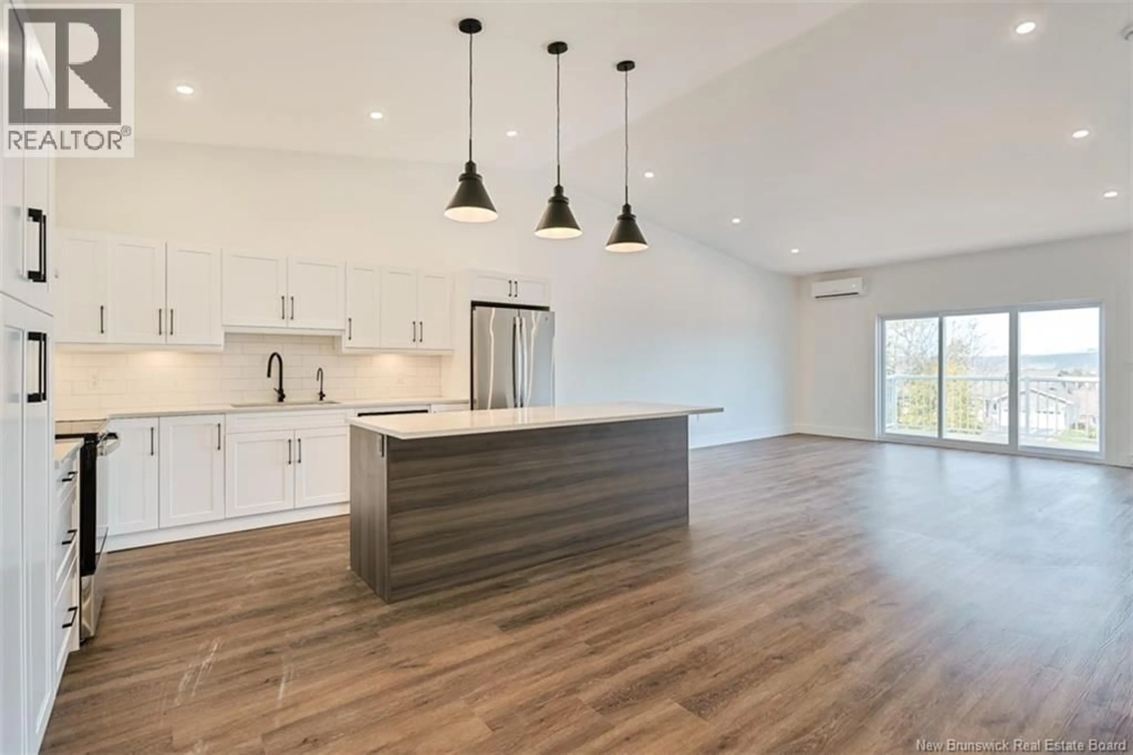 Open concept kitchen, wood/laminate floor for 21 WHITE PINE, Hampton New Brunswick E5N0P3
