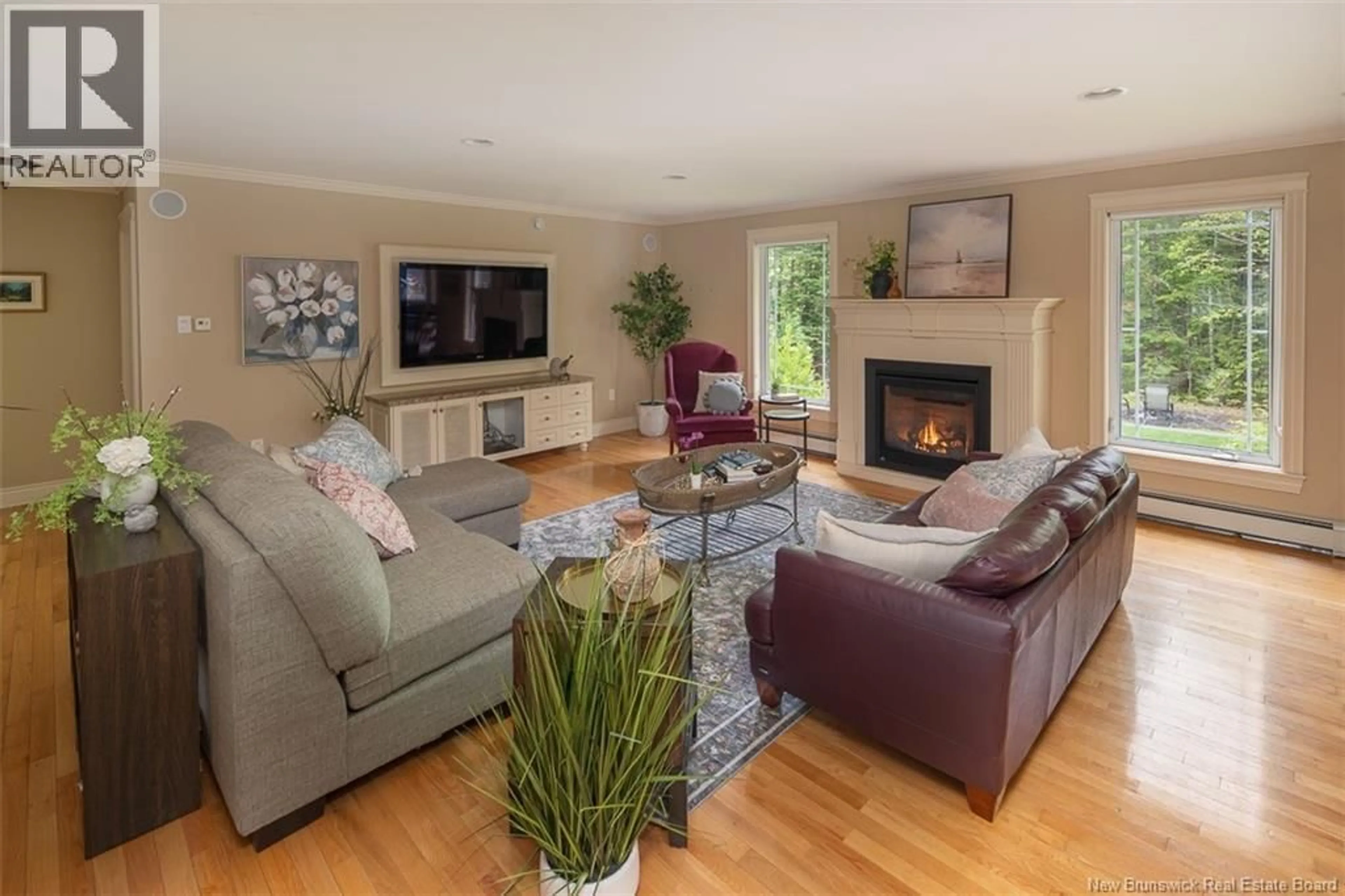 Living room with furniture, wood/laminate floor for 49 STARLING CRESCENT, Hanwell New Brunswick E3E2P8