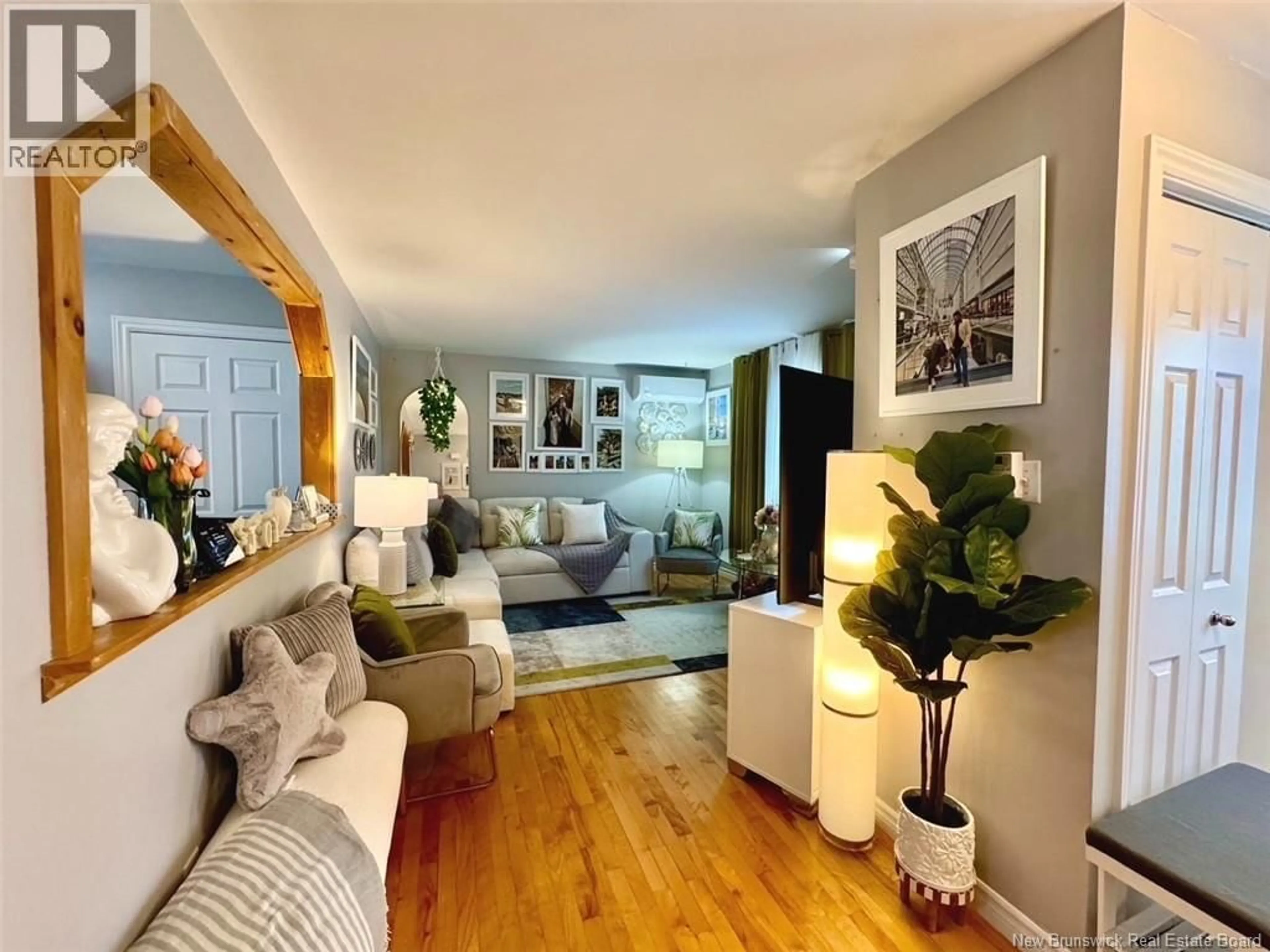 Living room with furniture, wood/laminate floor for 49 BEECHWOOD AVENUE, Moncton New Brunswick E1A5P7