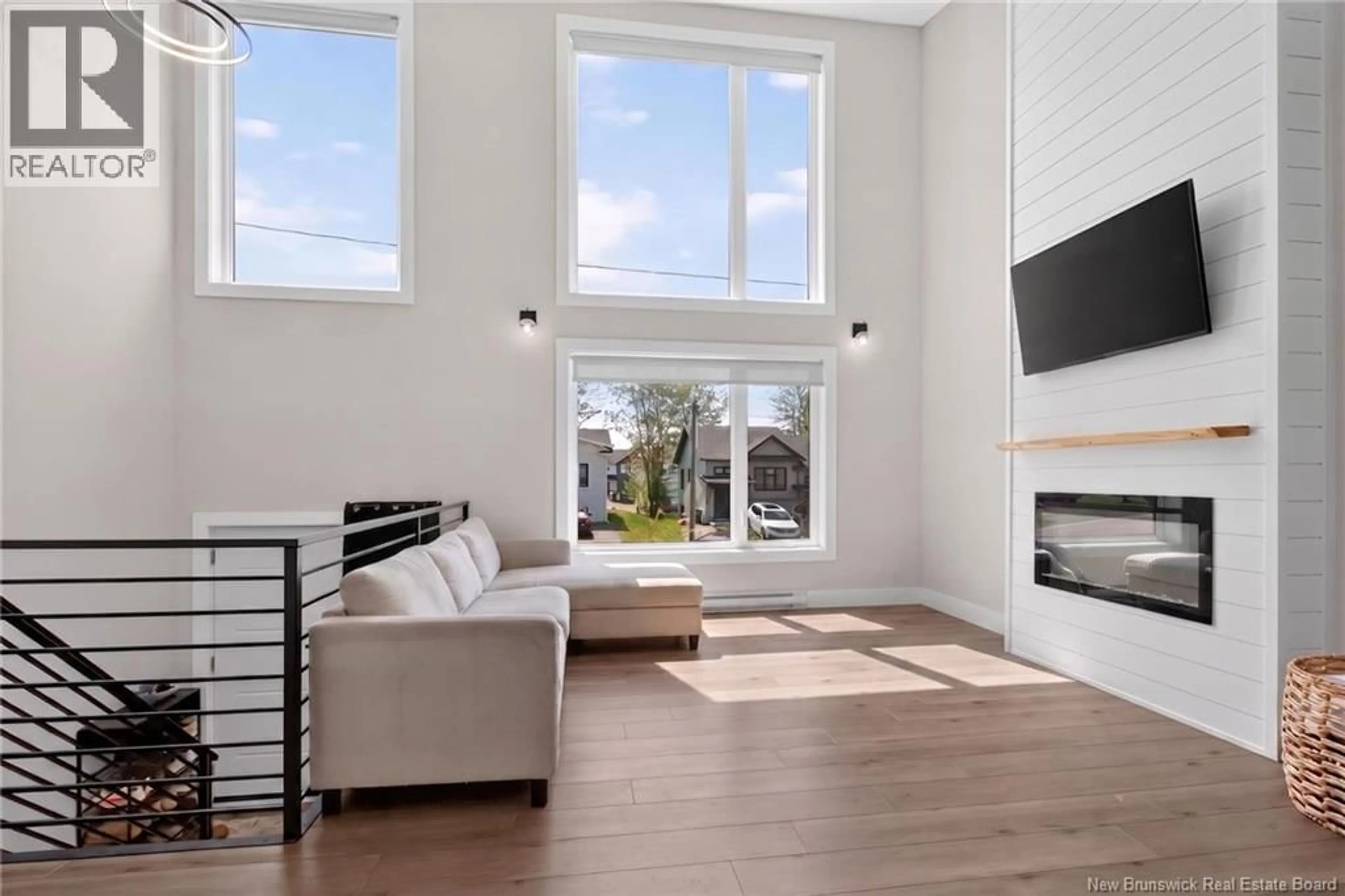 Living room with furniture, wood/laminate floor for 18 DE LA COLLINE, Dieppe New Brunswick E1A6N3